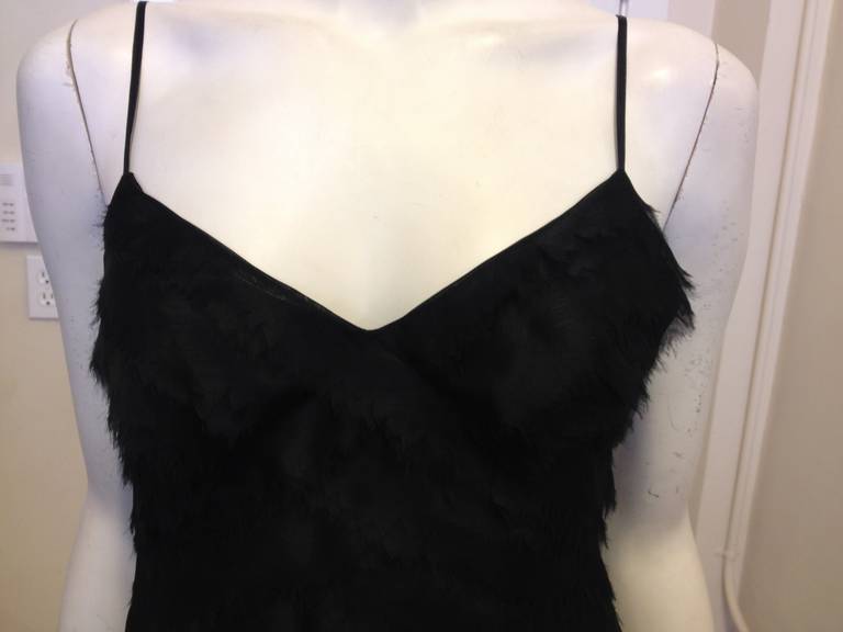 This gorgeous, delicate, frayed Hervé Léger tank looks like it's made of feathers. With an allover layering of raw edged organza pieces, this tank is the perfect piece to wear with something super simple and striking - a black silk column skirt or