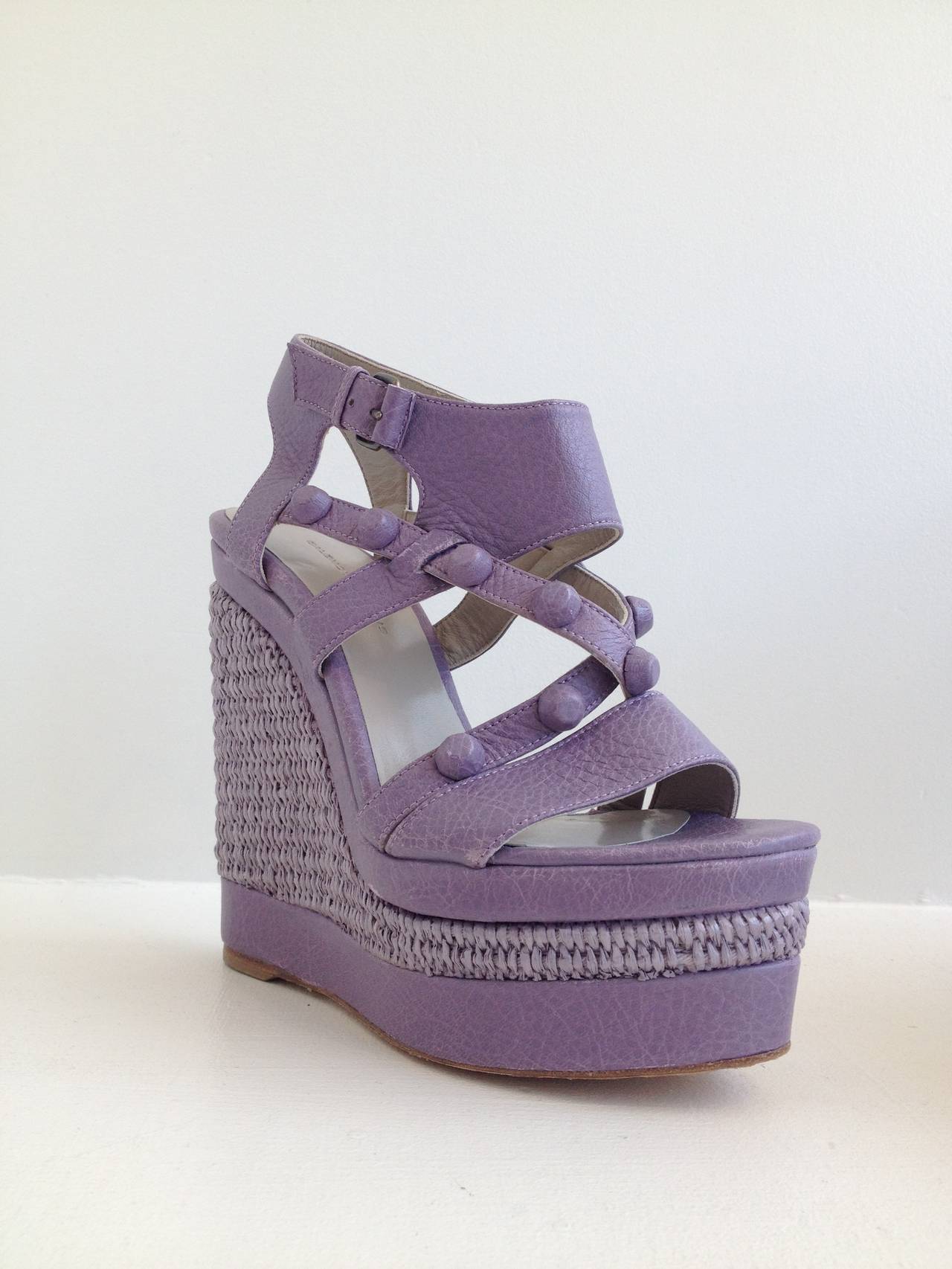 Stand tall! These Balenciaga wedges are perfect for making a statement. The soft lavender is easy and sweet, while the iconic Balenciaga conical studs - in this case covered in leather - add a little edge. The super tall 5.5