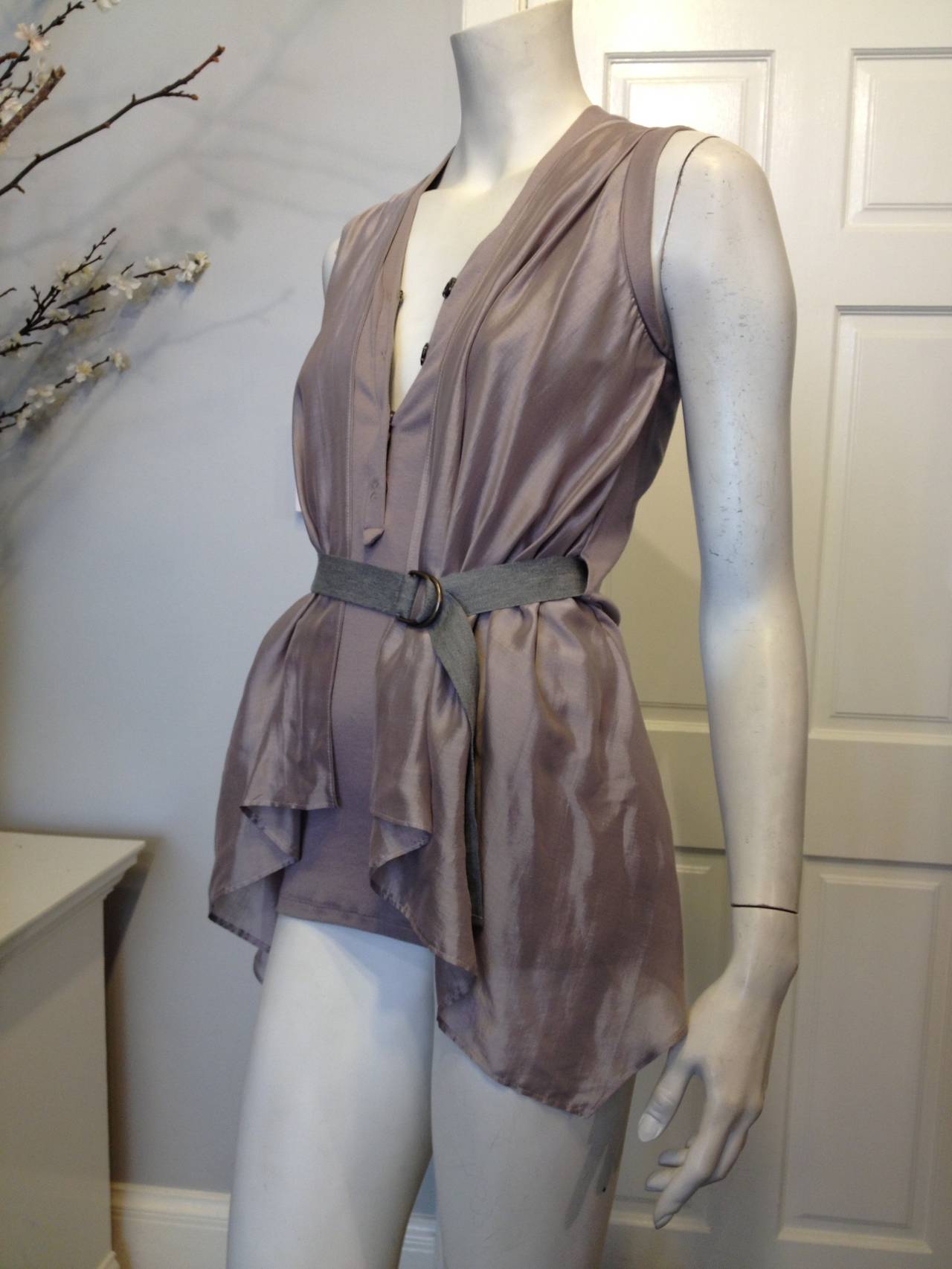 How ethereal! We love the way Brunello Cucinelli designs his pieces - they're interesting, but at the same time functional, timeless and so beautifully made. This piece features a finely ribbed tank with a snap placket, decorated with two layers of