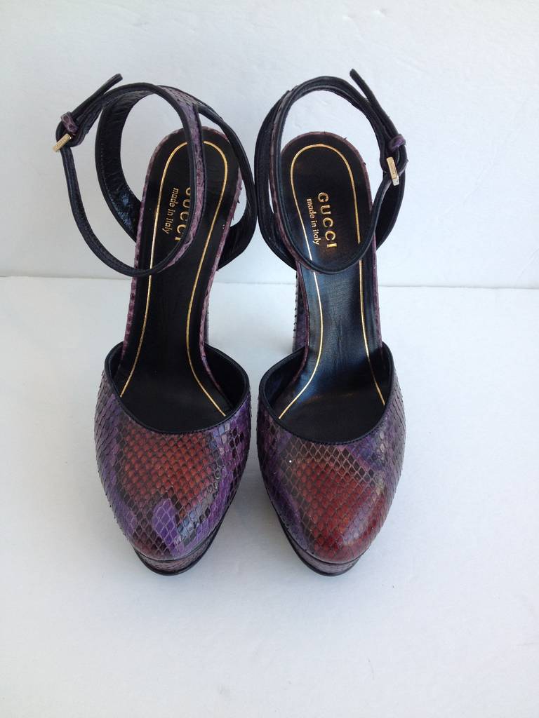 Take a walk on the wild side! These Gucci platforms instantly elevate any outfit, both aesthetically and literally - the heel height is six inches, while the platform is one inch. The gorgeous jewel-toned plum and dark ruby red colors are subtle but
