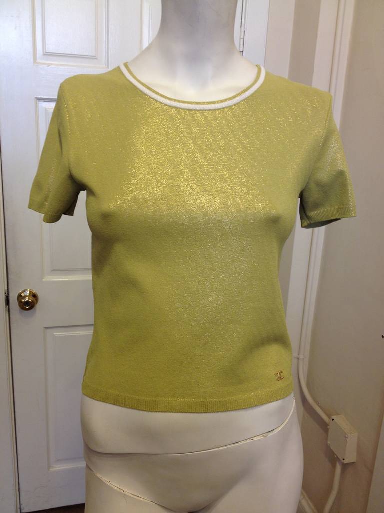 From the 2001 cruise line, this lime Chanel twinset is easy and chic. A slight gold sparkle in the material adds a little metallic glint, while the cream-colored trim pops against the green. Though they're perfect together, the pieces would also be