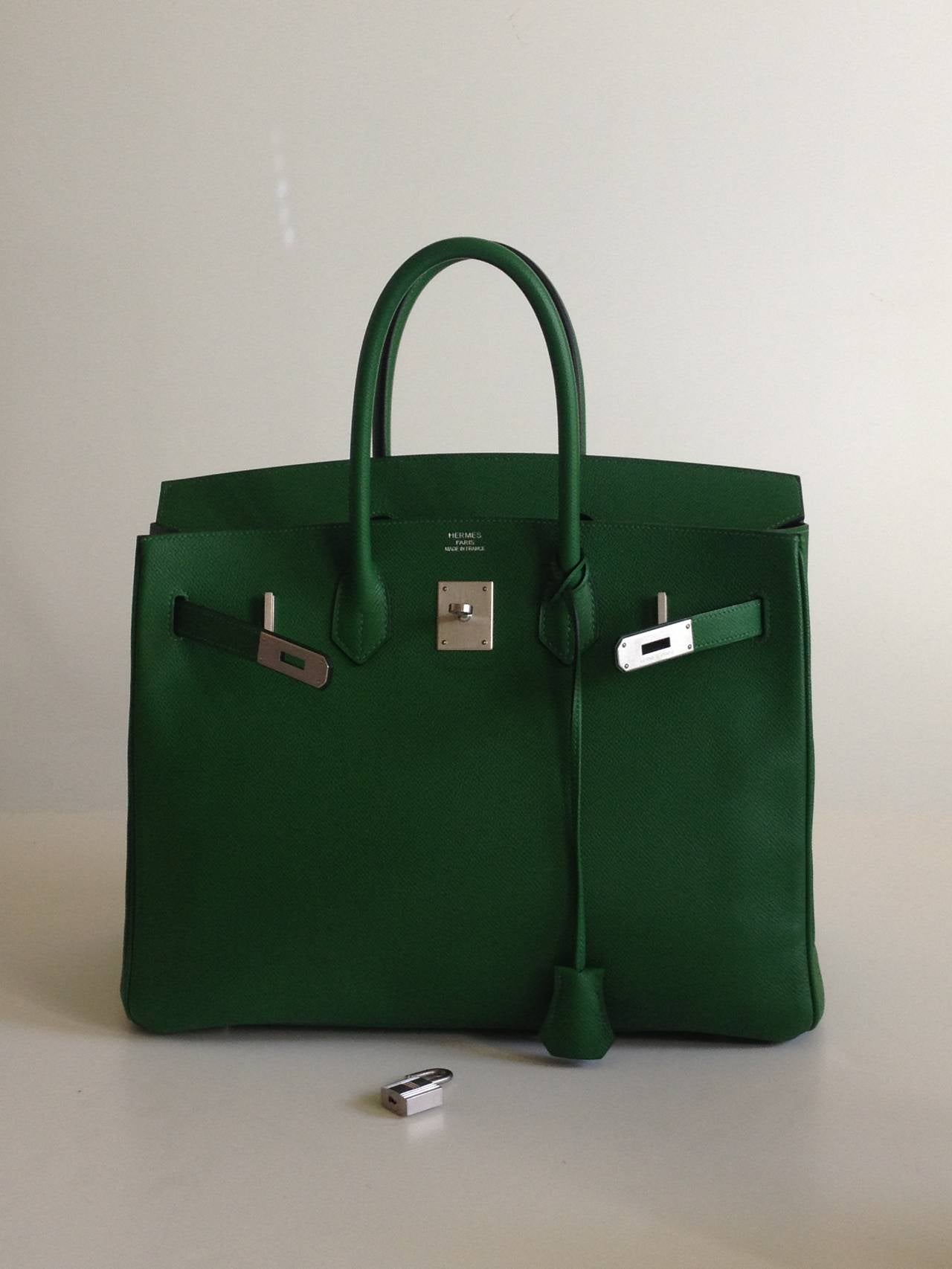 Gorgeous pebbled Clemence leather is absolutely perfect in this deep, lush, super saturated green. The Birkin is one of the most prominent symbols of elegance and luxury, and the substantial and spacious 35cm size in a deep and bold color like this