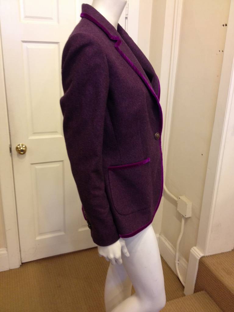 Everything about this blazer is eye catching. The wool fabric holds the clean lines of the tailoring well, while the shining deep purple velvet trim adds a luxe touch. The single button tailoring is modern and dressed-up, and complements the super