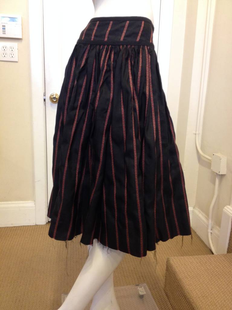 The looseness and the carefully deconstructed tailoring make this skirt really typical of Dries van Noten's elegantly undone look. The raw edged hem is frayed and asymmetrical, and the brocade stripes run at a diagonal to the cut of the piece. Wear