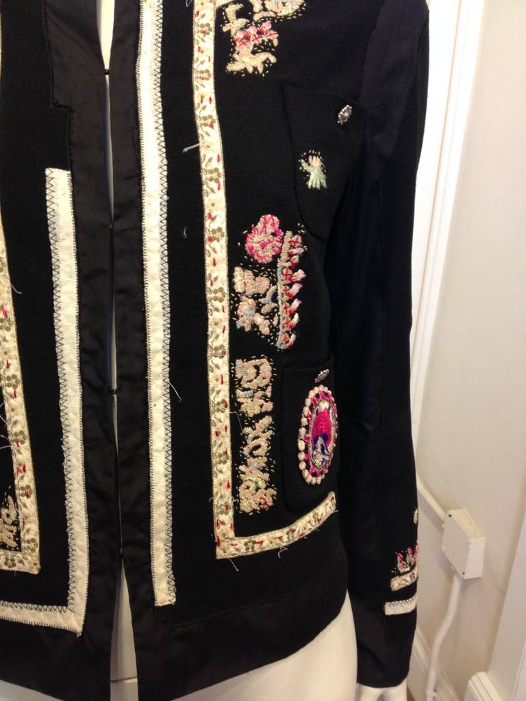 This beautiful Moschino piece is like the most gorgeous family heirloom - it looks unique and special, well-loved and full of history. The jacket is sprinkled with little patches of intricate embroidery in champagne, rose pink, blush, red, and royal