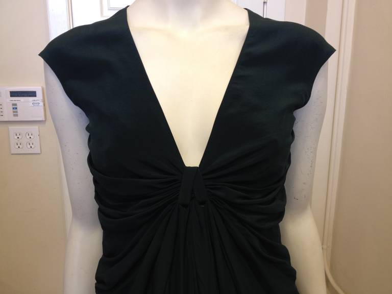 This dress is the epitome of Donna Karan's iconic style. Pragmatic but elegant, chic but sensible, Donna Karan's garments are designed with a busy New York lifestyle in mind - they're perfect for the woman who always looks fabulous from morning til