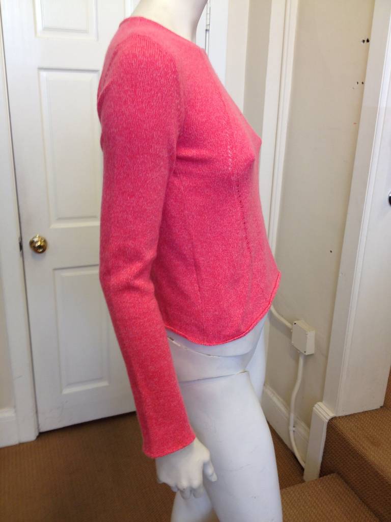 Lucien Pellat-Finet is known for his understated luxury cashmere pullovers, which look fabulous on their own but are also great for layering. This sweater will keep your winter warm, bright, and cheerful - just wrap yourself in this beautiful piece