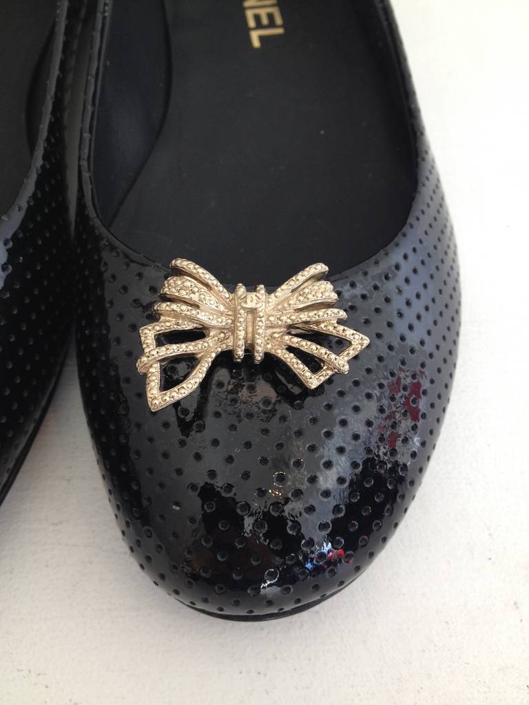 Chanel Black Patent Perforated Flats with Gold Bow In New Condition In San Francisco, CA