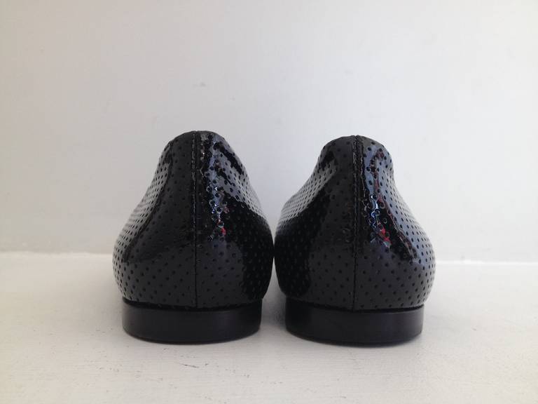 Women's Chanel Black Patent Perforated Flats with Gold Bow