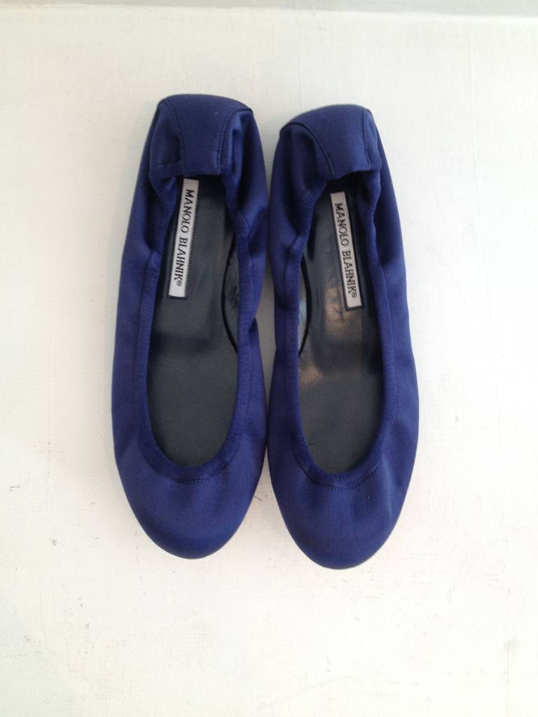 These flats are the perfect variation on dressy wear - instead of your usual sparkly strappy heel, go for these deep midnight blue satin ballet flats. They're subtle but gorgeous, unfussy but beautiful - wear with a metallic silver dress or with a