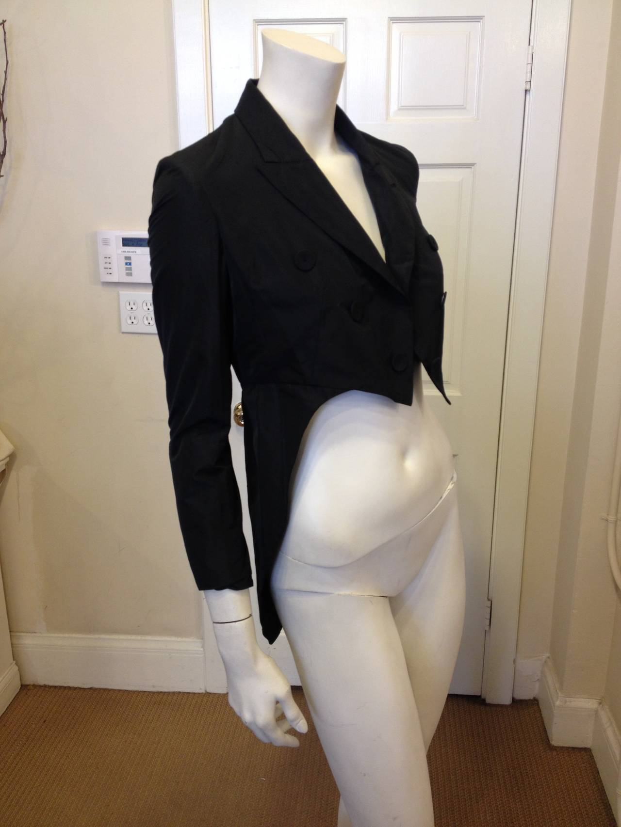 Evoke Marlene Dietrich in this sharp Gaultier. The tailcoat - as a garment - always has an ineffable androgynous glamor, both Old Hollywood and timeless, both masculine and feminine. This rendition is especially smart - the hemline is sharp and