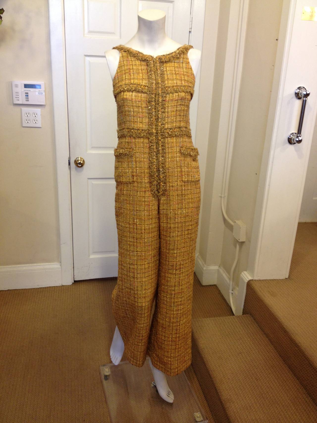 This Chanel ensemble suit is positively amazing! The warm, earth-toned mustard yellow is perfect for any season but feels especially right in autumn, while the tweed is timelessly and unmistakably Chanel. The ensemble consists of both a jacket and a
