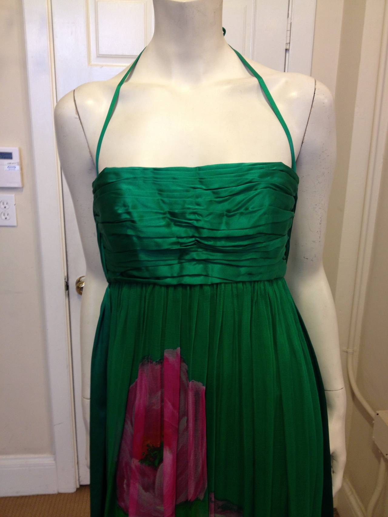 This amazing emerald green dress exemplifies all that made Galanos a favorite designer of Marilyn Monroe, Elizabeth Taylor and Jackie Kennedy, just to name a few.  The green chiffon drapes from the pleated, silk bodice  and the sexy, low cut back is