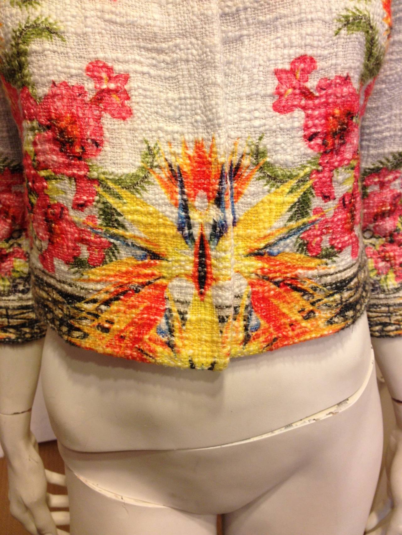 This eye catching Givenchy jacket with its orderly explosion of flowers on the front and back panels, and on the lower part of the 3/4 sleeves, makes you dream of Mediterranean gardens. It has a body conscious fit with a small turned down collar.