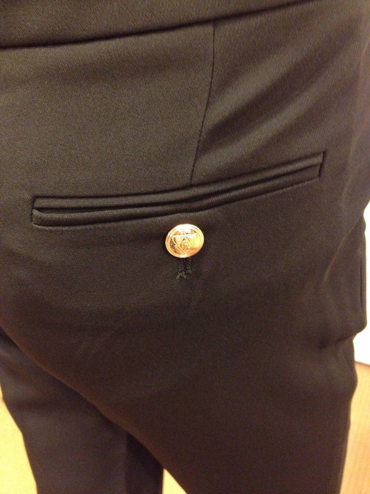 black trousers with gold buttons