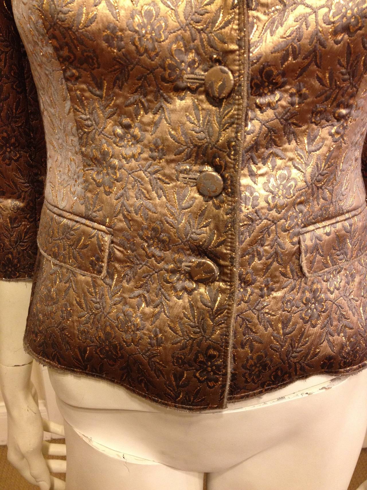 Glimmering, elegant, and fabulous - this jacket is the perfect way to finish any look. In a deep toasted bronze brocade with a lively but subtle floral pattern, it's beautiful in a classic way. A jacket so glamorous is always useful - it will be