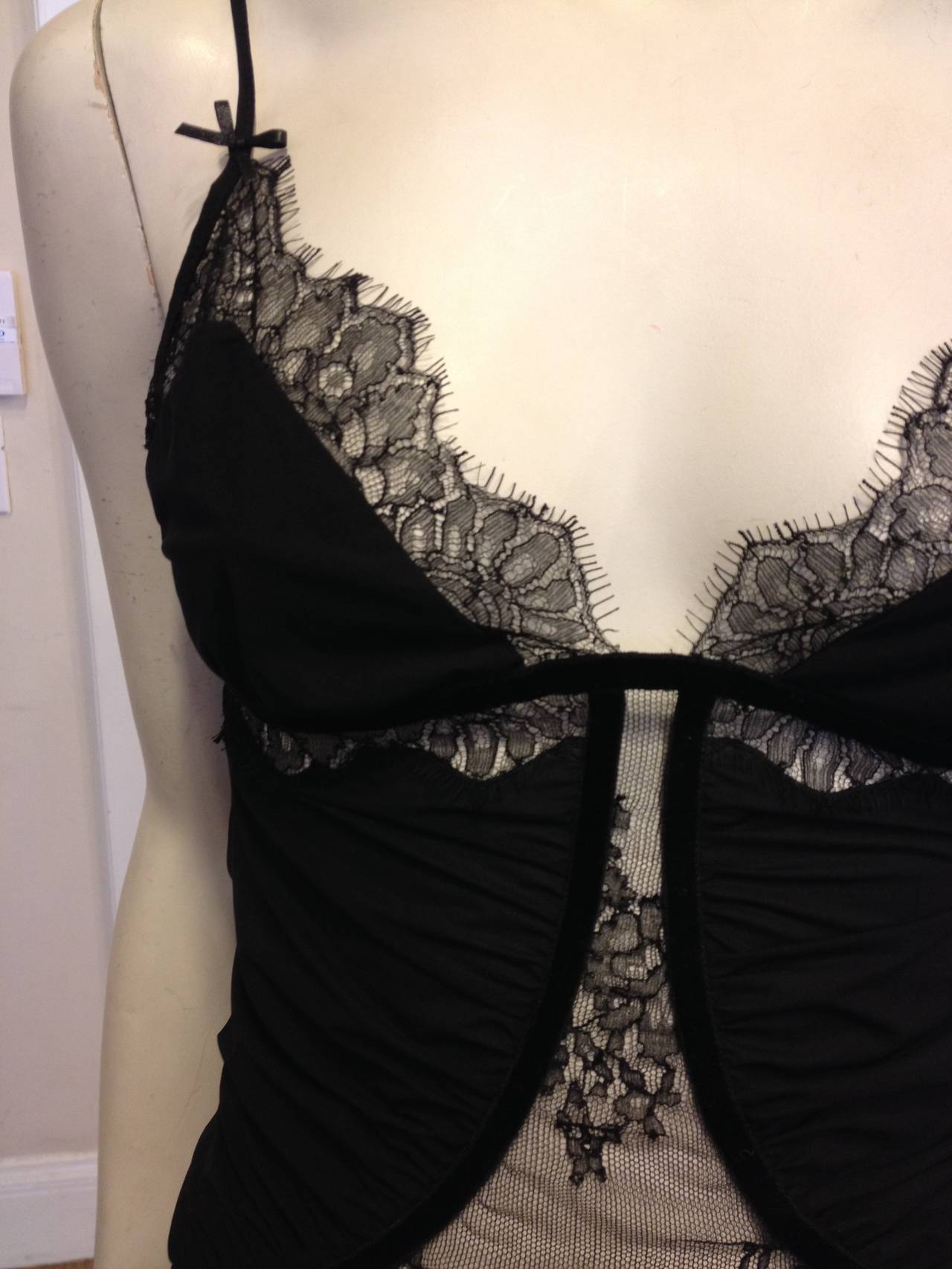 This super delicate camisole is just too sexy. With gathered super soft almost sheer panels interspersed with lace, and trimmed with a black velvet ribbon. It's a fabulous piece. The lingerie-inspired look is perfect for wearing with a leather