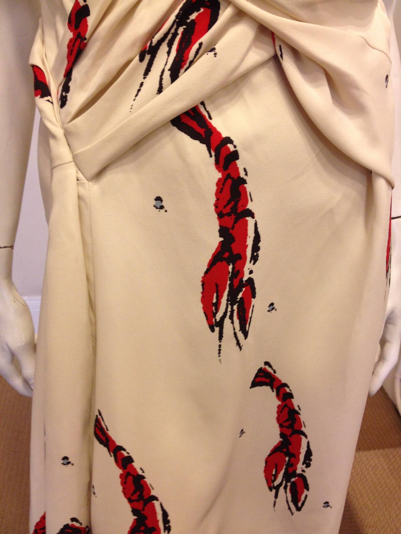 Cheery and bright lobsters in red on a creamy white fabric make us feel like we're right there in Cape Cod on a breezy summer day. This dress is absolutely perfect for hot weather, and the fun print and the casual style are great for those
