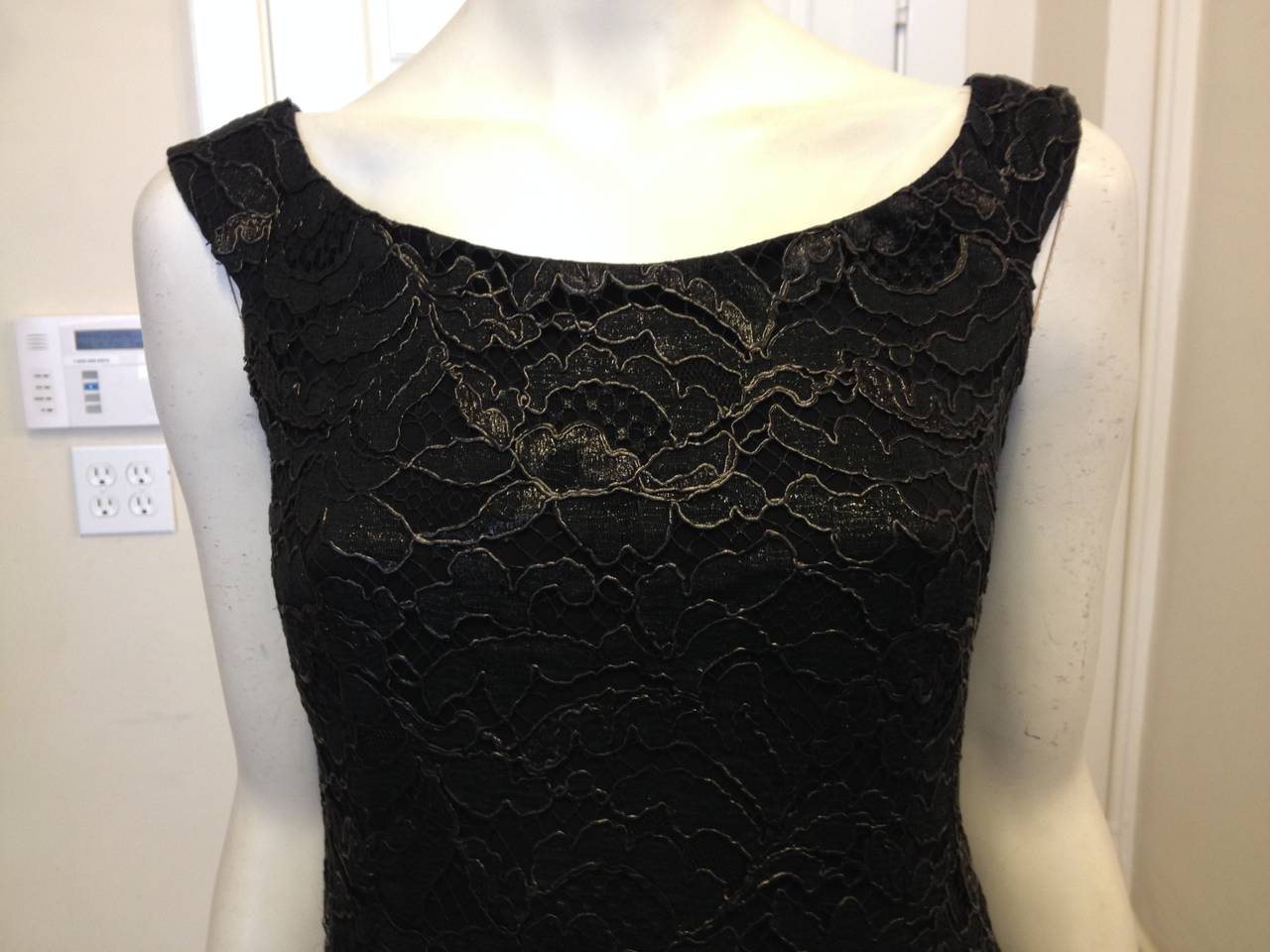 Black lace takes on an edgier role for this Gucci dress - coated with a super thin rubberized layer, it has a matte finish and a futuristic texture. The boatneck cut and slim shoulder straps add a classic look to the piece, cutting the innovative