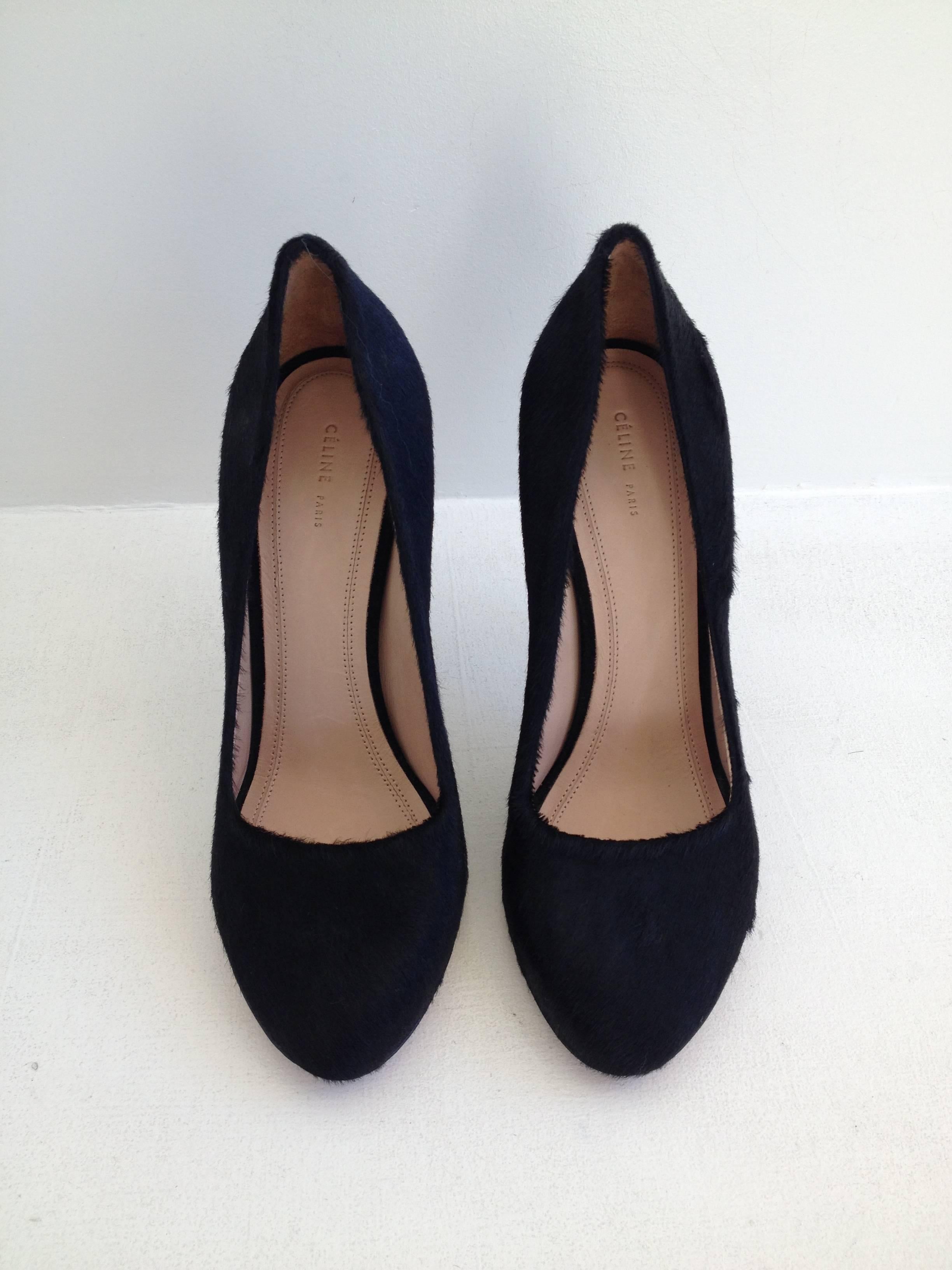 Simply gorgeous. Ultra sleek and cool black ponyhair covers the body of these classically shaped Celine pumps, which feature a 4.25 inch stiletto heel and square cut opening at the toe. Wild but elegant, these are the perfect Celine shoe!