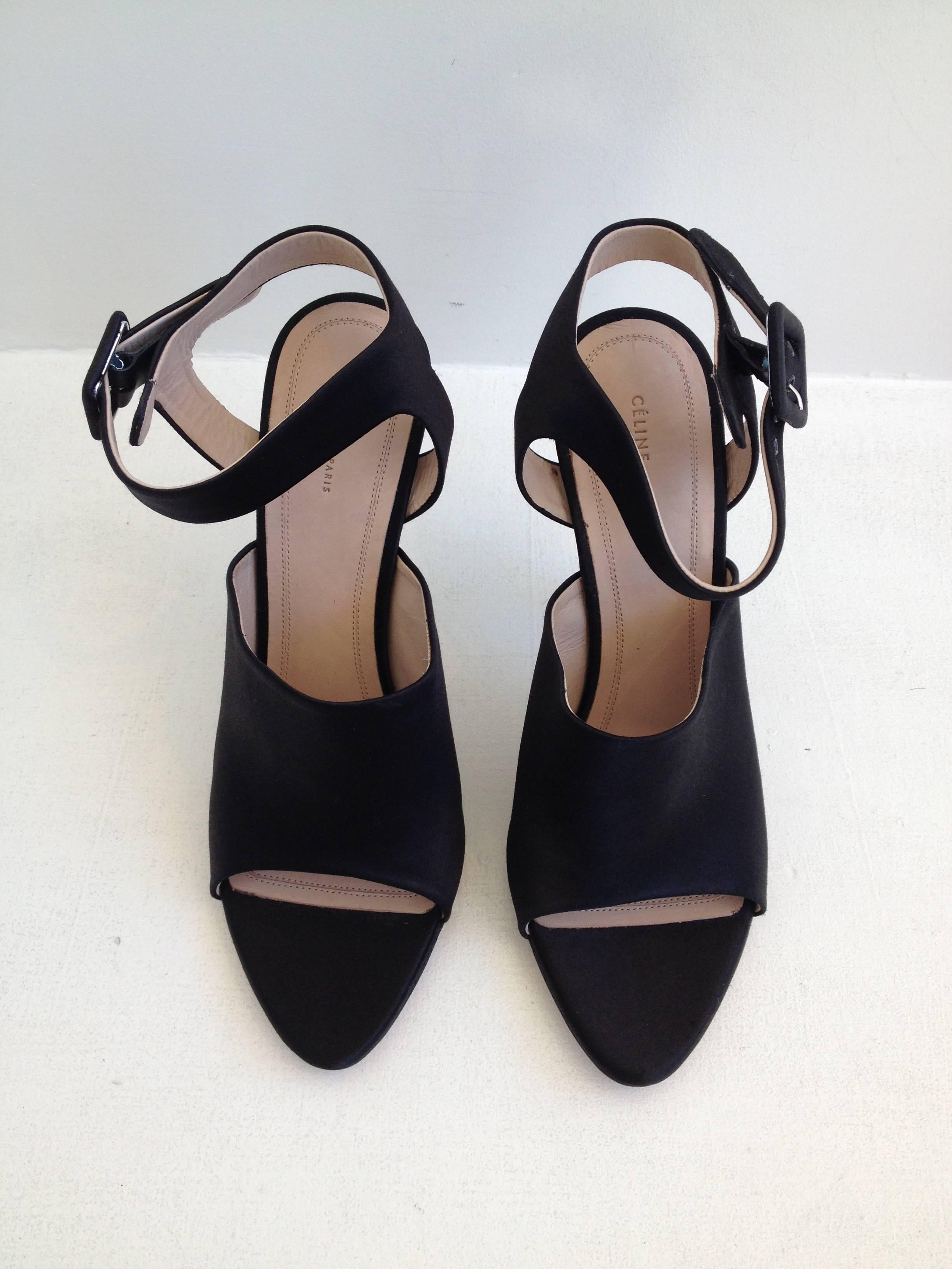 Modern, architectural, and edgy, they're beautiful and cool at the same time. The front is mule-like but with a cutout toe, while the back has a wide ankle strap and a high 4.5 inch stiletto heel. So sleek!