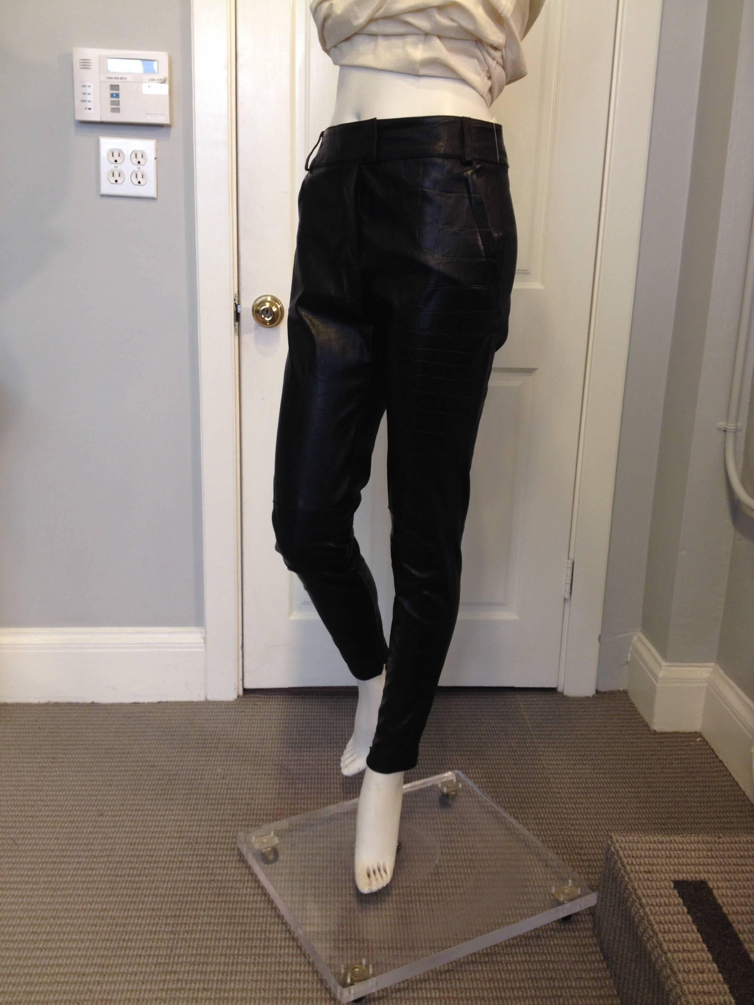 There's nothing more rock & roll than a pair of black leather pants. These have all of the attitude that Givenchy embodies - they're cut super skinny, with zippers at the ankles and crossing belt loops in the shape of an X at the back. The leather