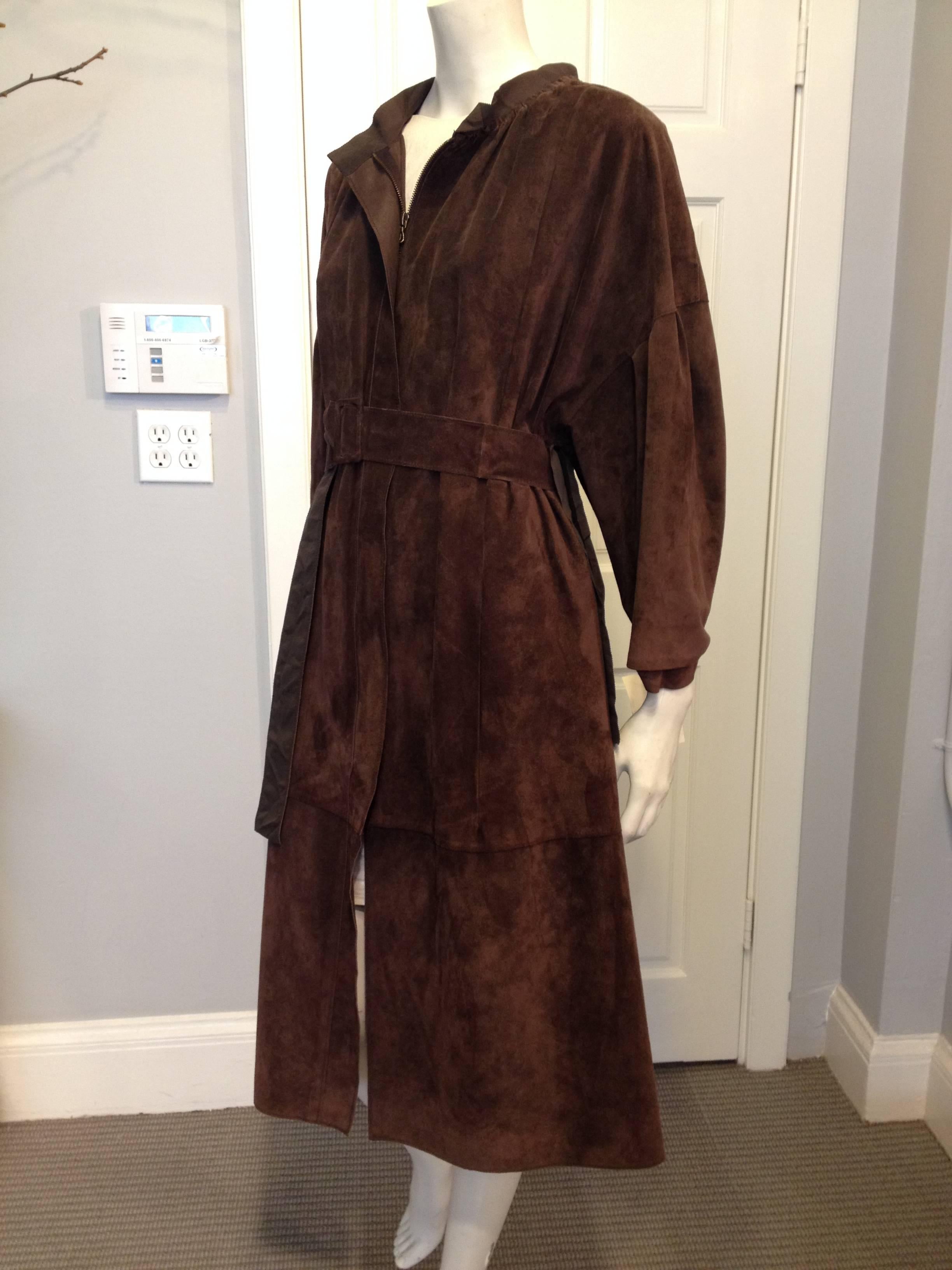The beautiful and iconic draping distinctive to Lanvin looks wonderful in suede, especially such a lovely and luxurious soft velvety brown suede. The collar is lined with grosgrain, and the sleeves are cut voluminously and pleated but tapering to
