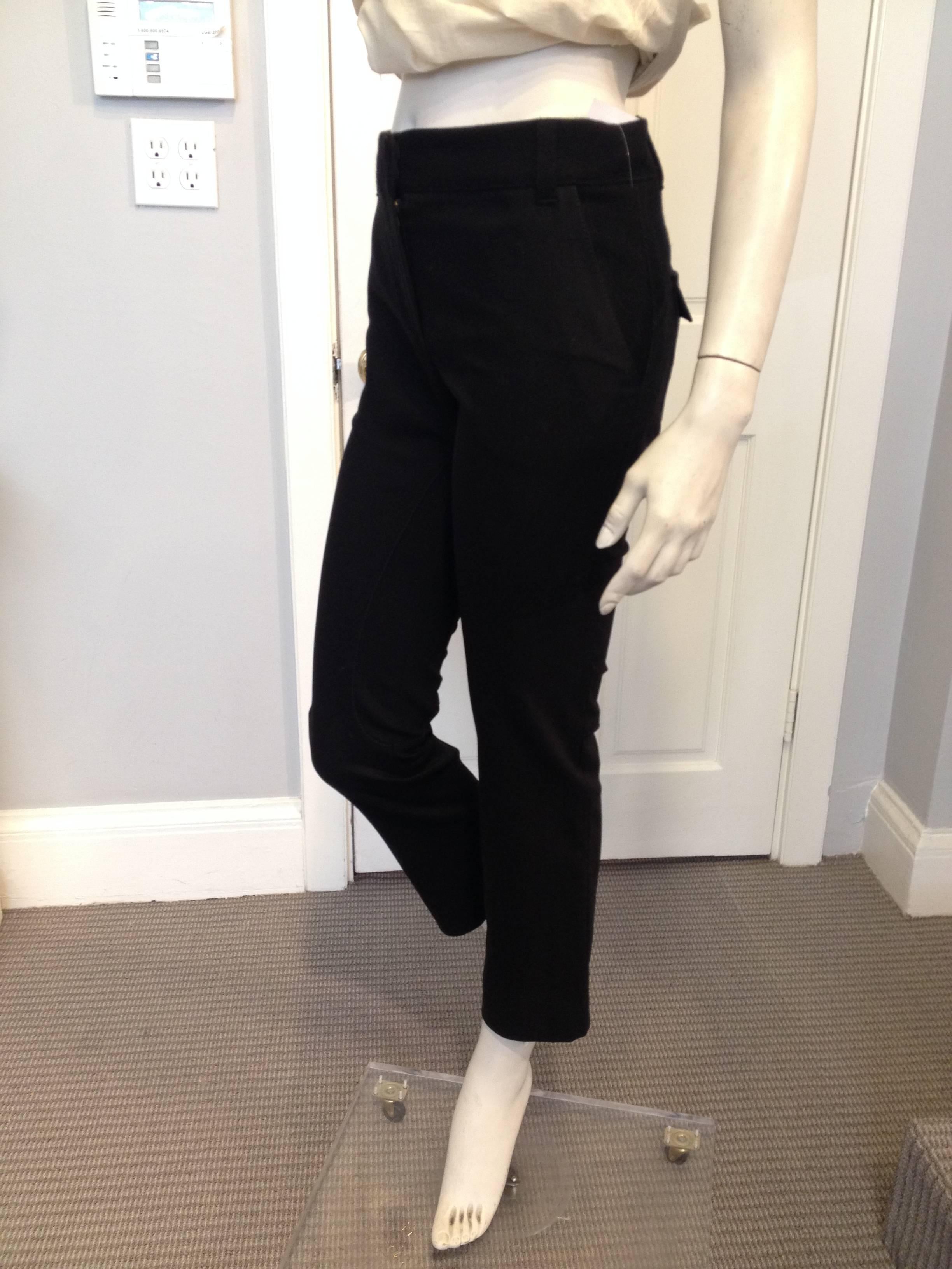 These pants offer military styling in a wearable way. Cut from a combination of two fabrics, a smooth woven textile and a softer woolier cashmere blend, these pants are cool and effortless, perfect in the spring with a t-shirt or with a cashmere