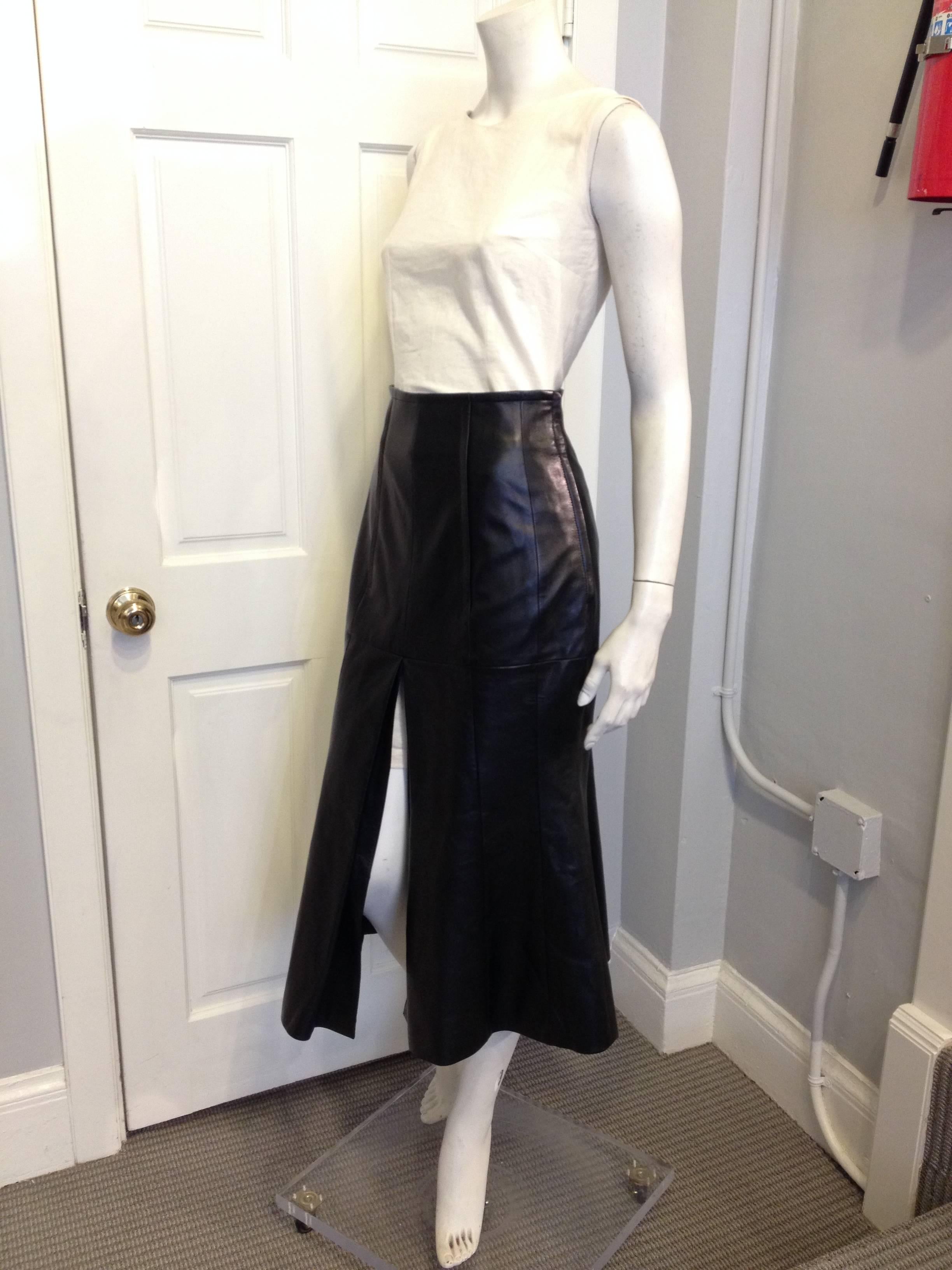 Dramatic, striking, and seductive, this Christian Dior skirt lies at the perfect intersection between an ultra-flattering fit and and cool and contemporary fashion. The high waist and slim hips fit snugly, while the skirt flares out into an angular