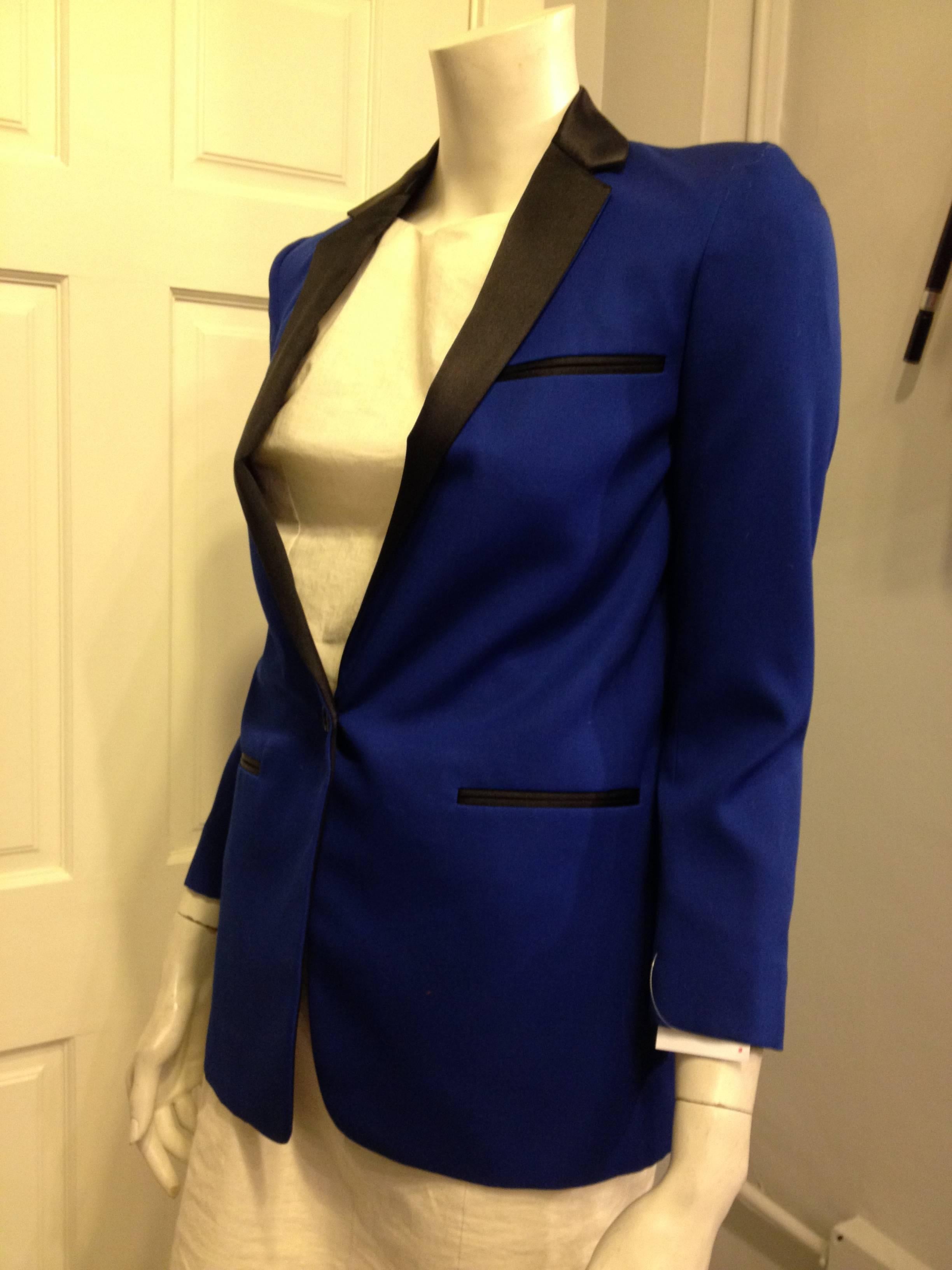 How modern. This Celine blazer has such an impeccable cut and fit, and it pops even more in the gorgeous royal blue color. The single button closure nips in the waist, while the relatively straight cut keeps the piece contemporary. The glossy black