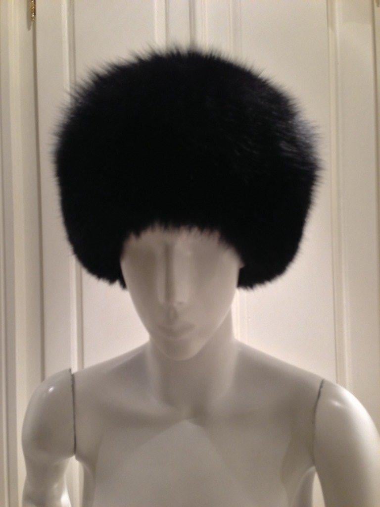 Stay warm and always look fabulous with this black Eric Javits Mink hat.  The soft fur is lined in a rich red satin fabric.  Perfect for cold winter days and nights as you explore the streets of the city.

Circumference 21 inches