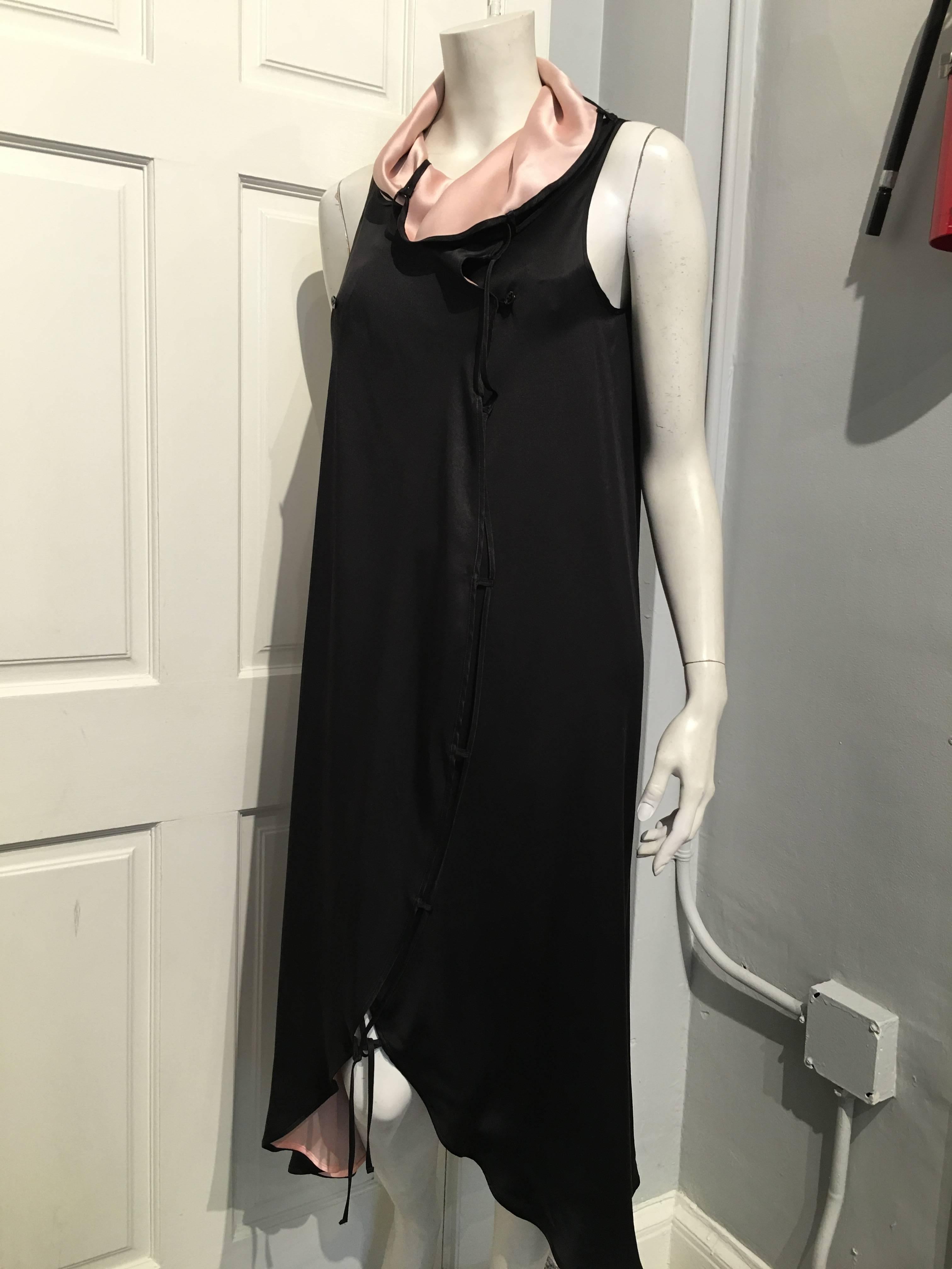 Issey Miyake long, sleeveless black silk satin dress with pale pink lining and drape neck collar. It has a lattice type accent down the front with a 1/4