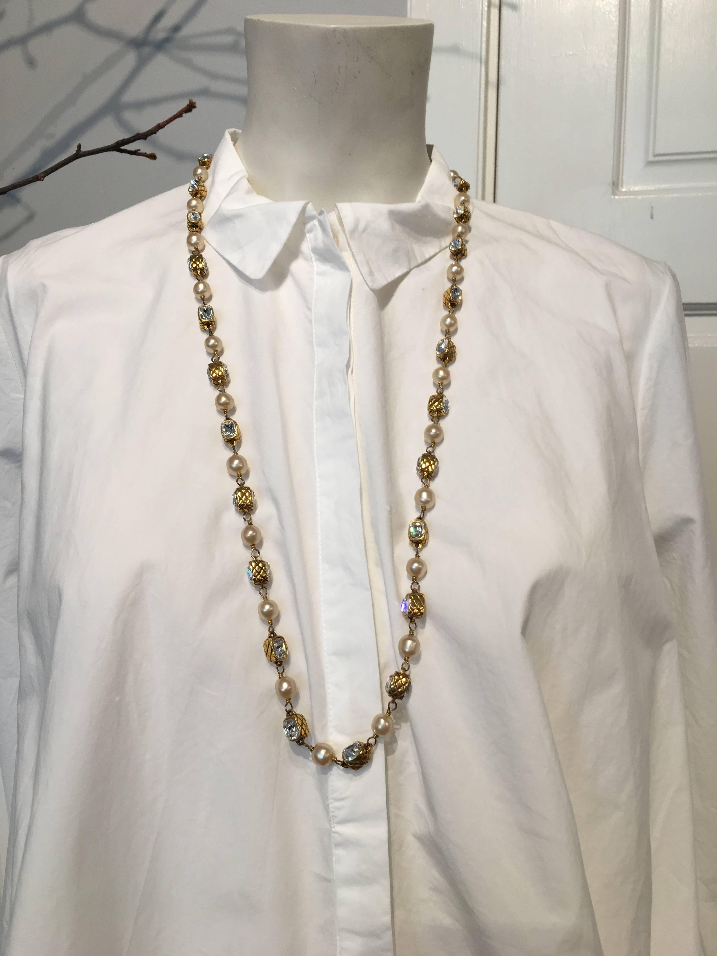 Chanel necklace with pearls and bezel set crystal in gold-tone metal, with quilted pattern on sides.