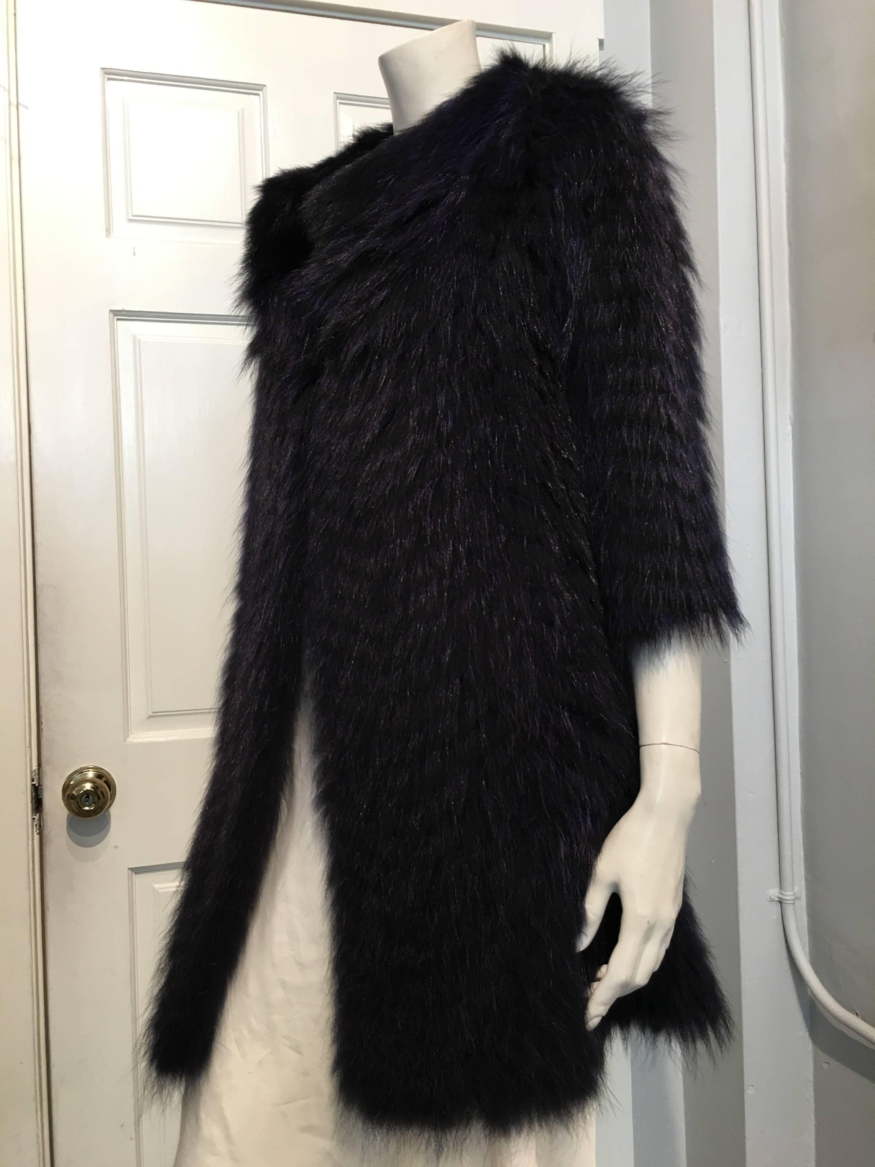 Cassin purple and black fur coat made with raccoon pelts sewn in a chevron pattern on black polyester backing.