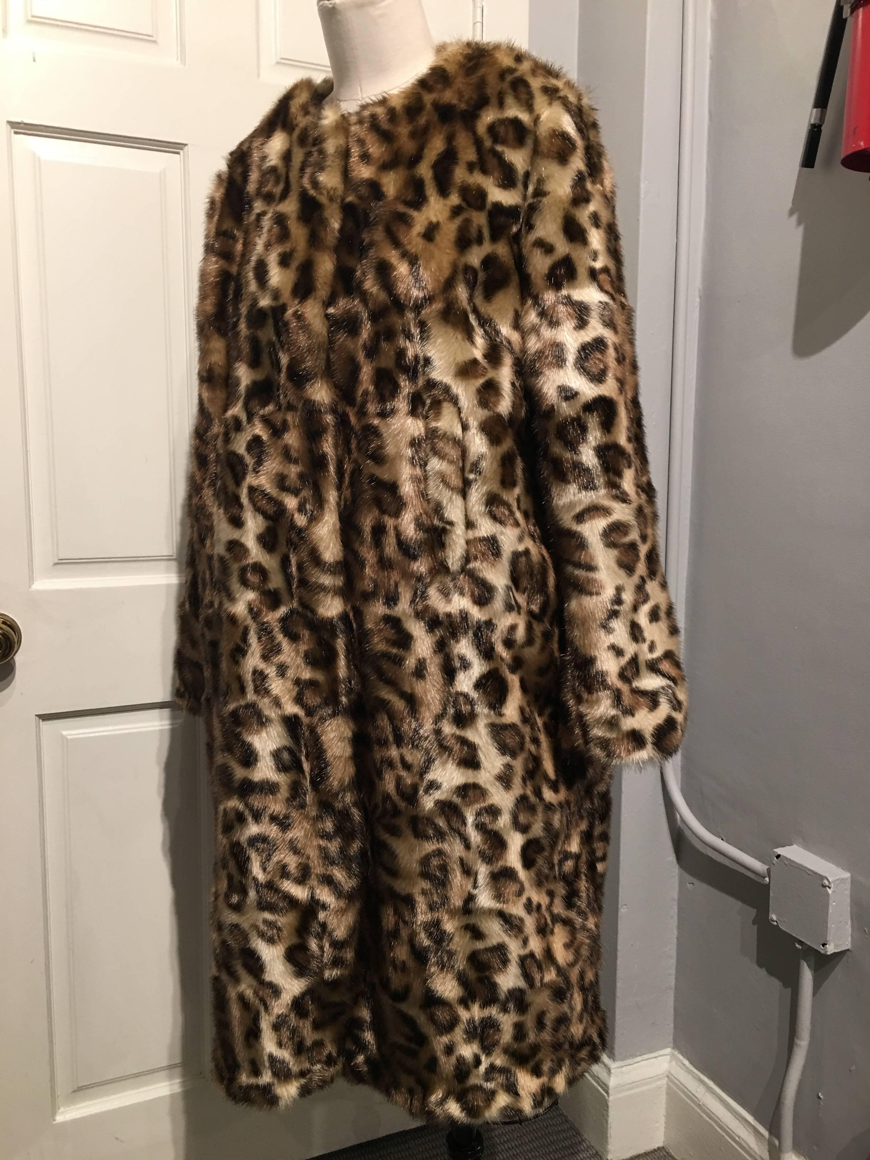 Simone Rocha faux fur coat in a leopard print pattern. The coat closes with 4 hook and eye closures. The coat is new with the original tags.