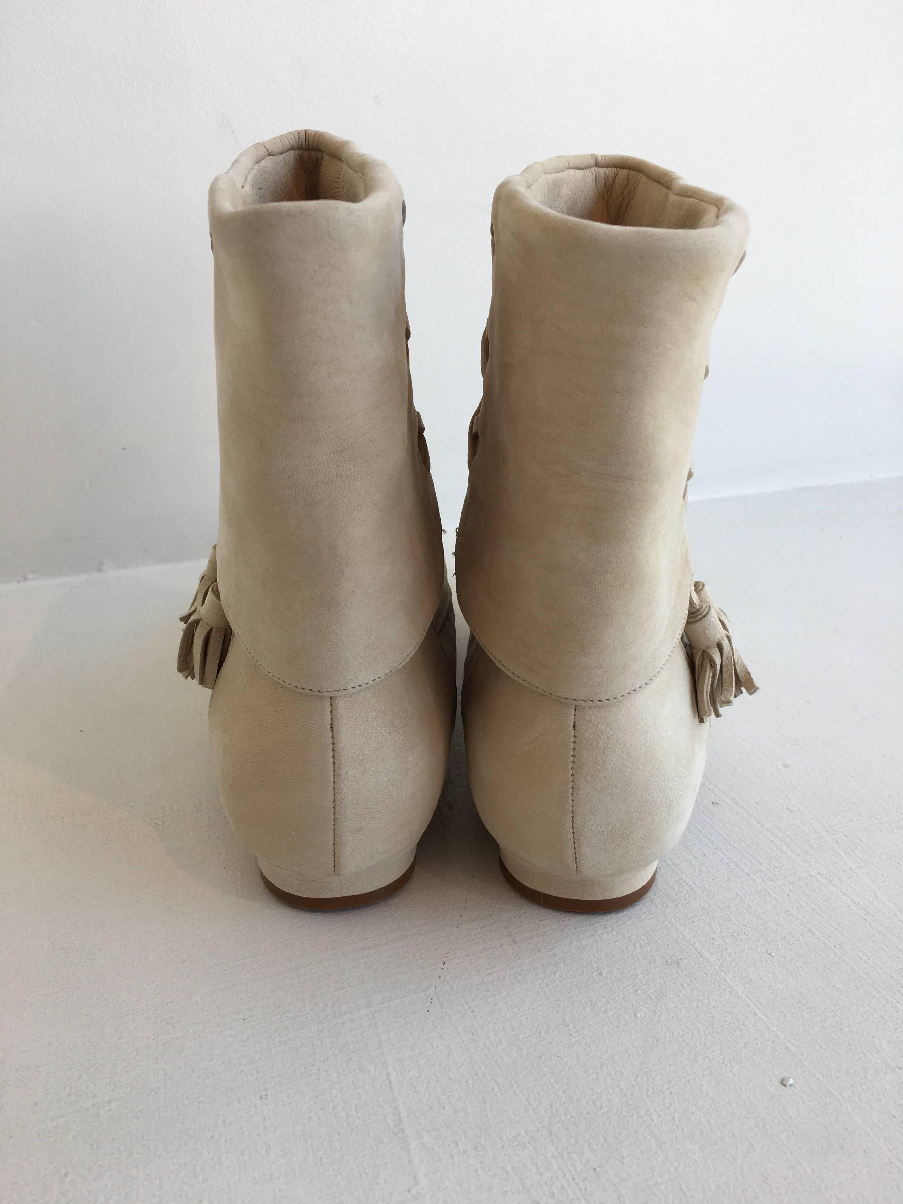 Manolo Blahnik beige suede moccasin style booties with tassel accents