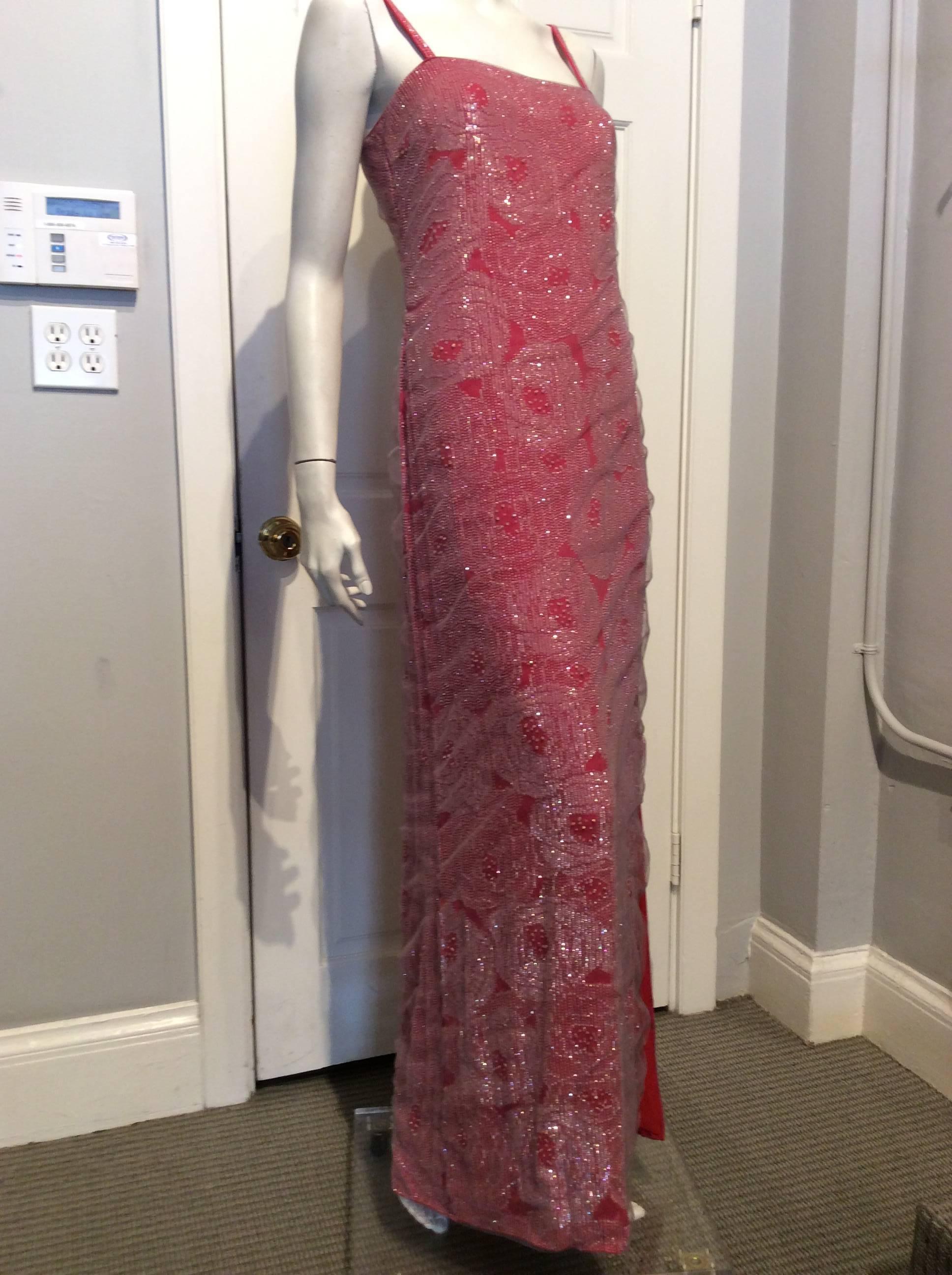 Giorgio Armani coral spaghetti strap evening gown, with silver and clear sequins and beads in elegant rose patterns.  The spaghetti straps are 3/8
