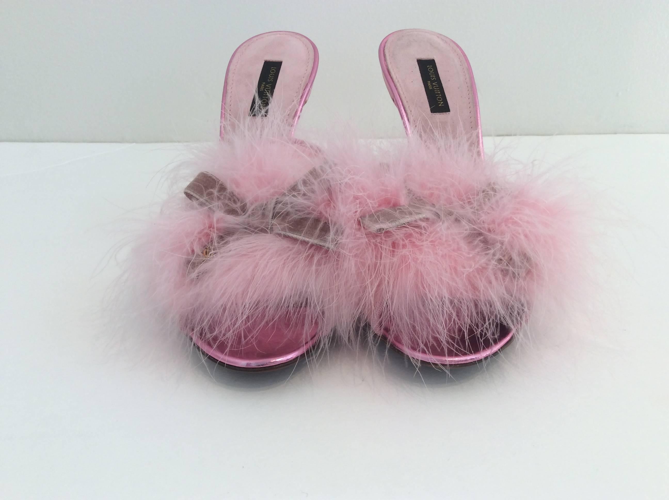 Elegant yet still playful pink satin mules trimmed with grosgrain. The soft gathering of feathers is held down by a single mauve velvet bow in the middle. The heel is 4.5 inches, with the lower 1.5 inches wrapped in gold leather detailing. 

(Please