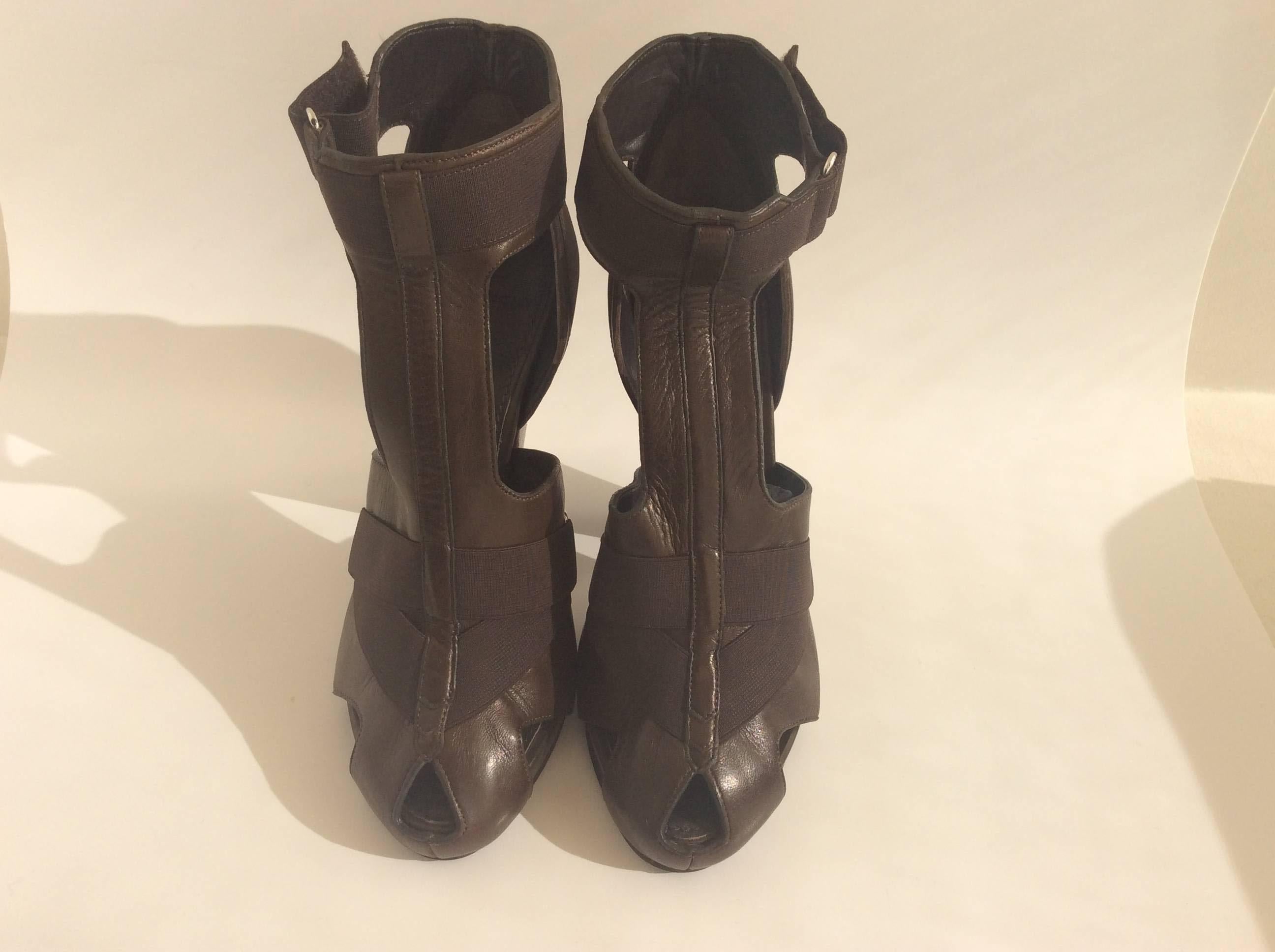 These Givenchy leather dark brown sandals will compliment any women's foot. With it's .5inch platform, 5inch heel and elastic straps these would be perfect for a night out on the town.