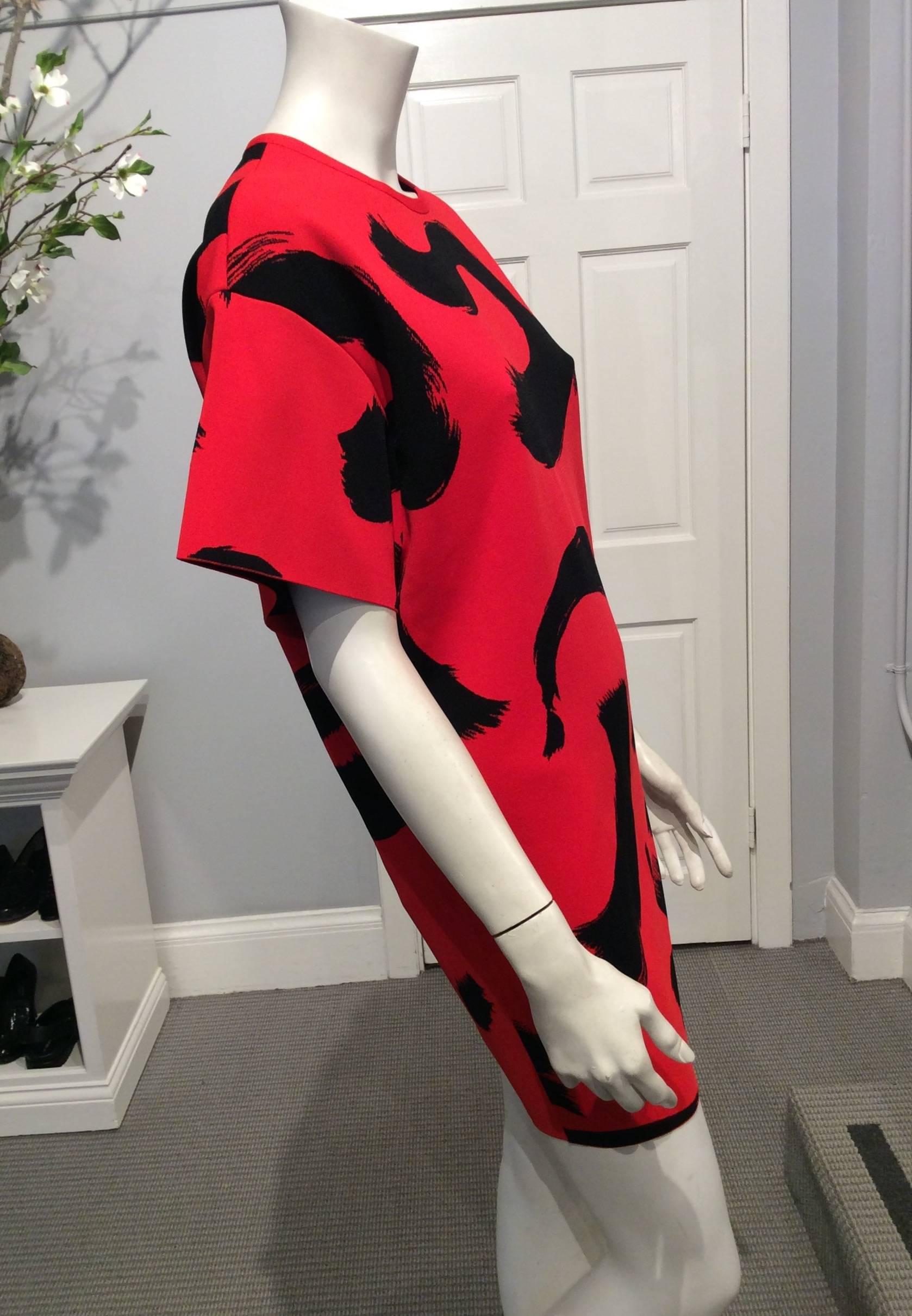 Celine short sleeve red dress with black paint brushed design.