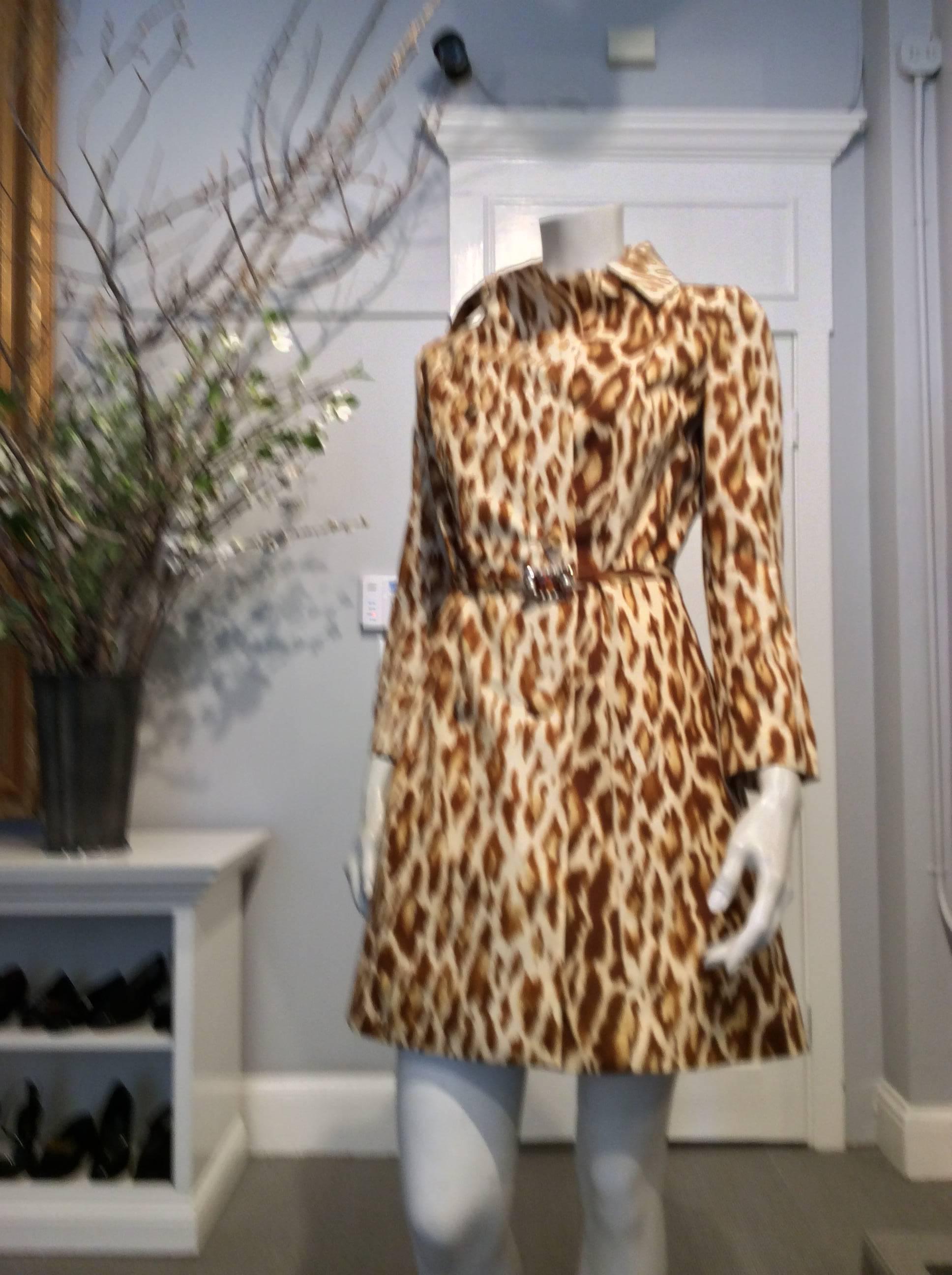 Christian Dior silk coat in ivory and rust brown leopard print. The waist is accentuated by a 1/2in wide fabric belt with jeweled in topaz and pearls. It closes with a double row of fabric covered buttons.