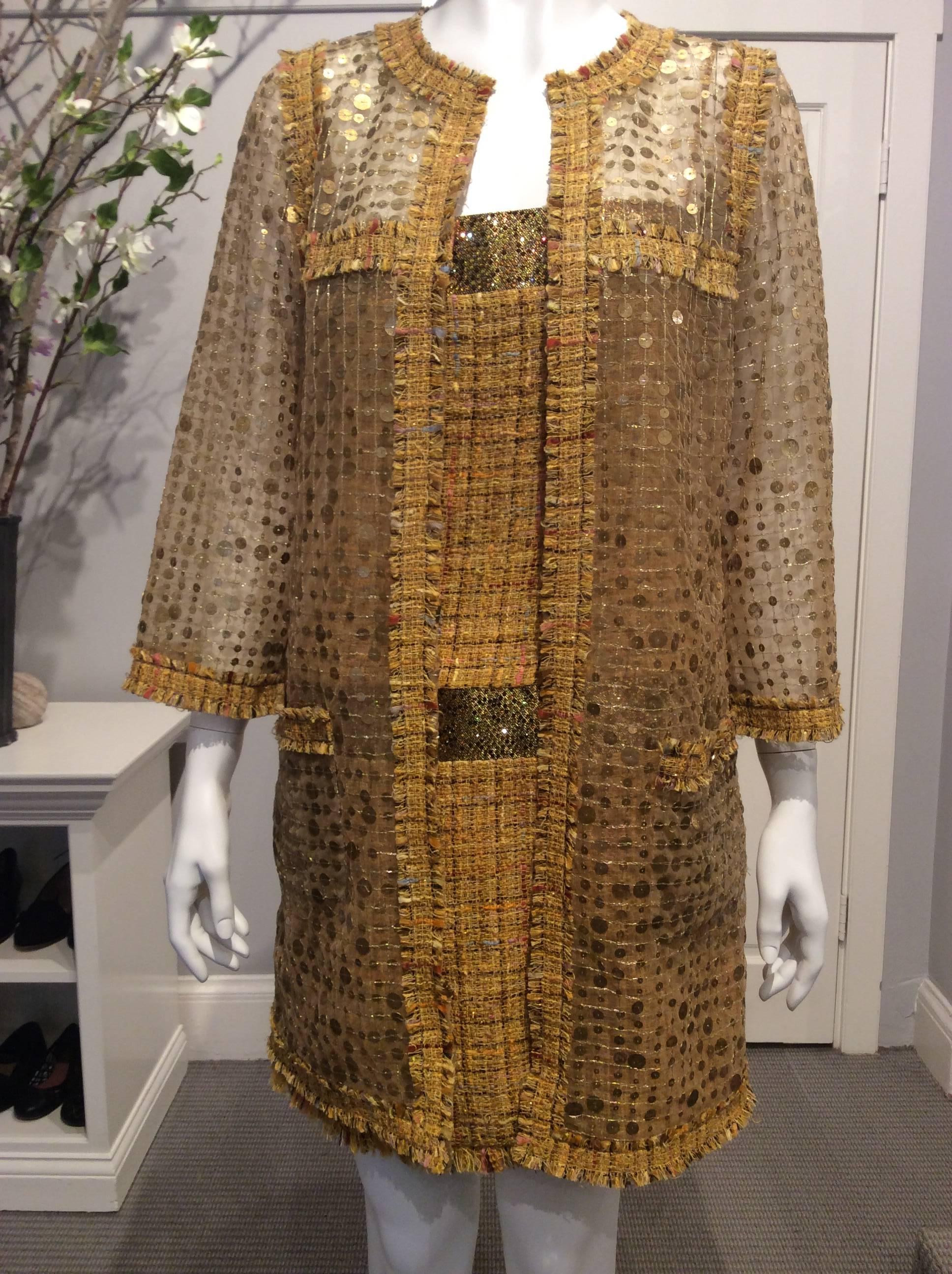 Elegant two piece Chanel outfit consisting of a dress and a semi sheer coat. The fabric of the dress is a soft looped tweed in the warmest sunflower yellow with a delicate grid in brown and random threads in different muted shades that range from