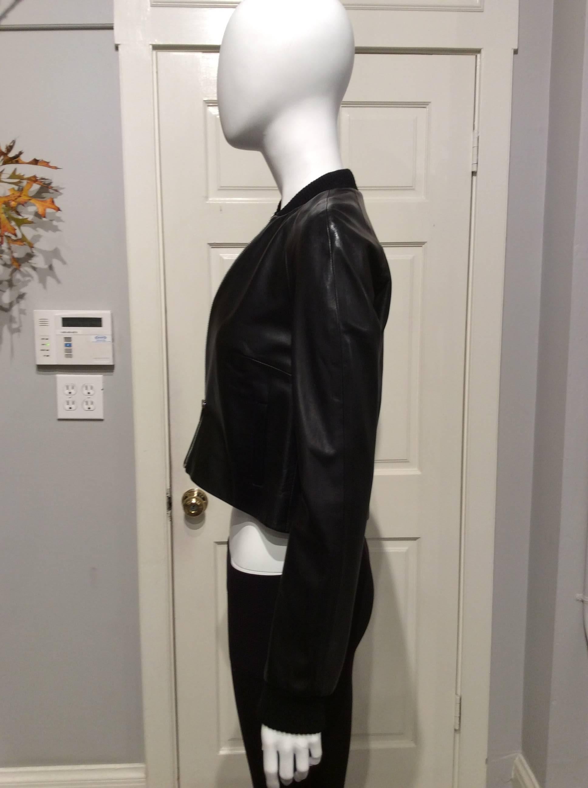 Black Christopher Kane bomber jacket in the softest leather. It has knitted cuffs and collar, two 4in long slit pockets, and it closes with a silver colored metal zipper.
The item is brand new with tag.