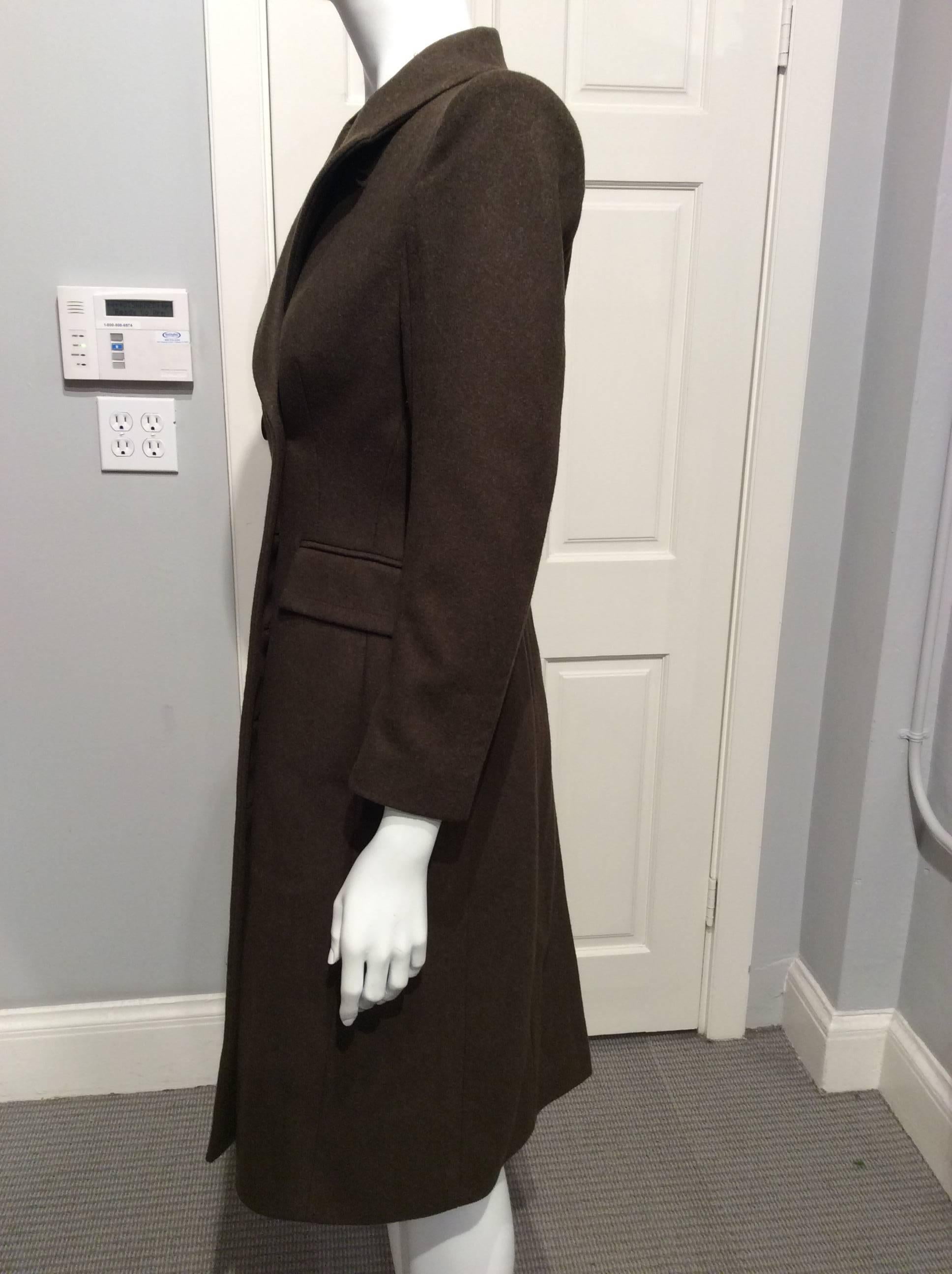 Olive green double breasted coat.