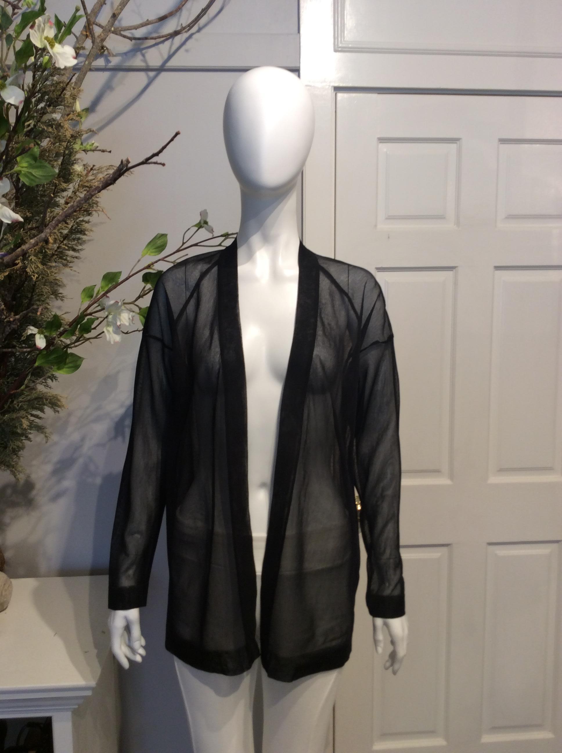 Black Alaia black silk sheer open cardigan. New with tag and never worn. Original retail price of $1565.

Sizing: Fr36, Us4

Fabric content: 100% Silk