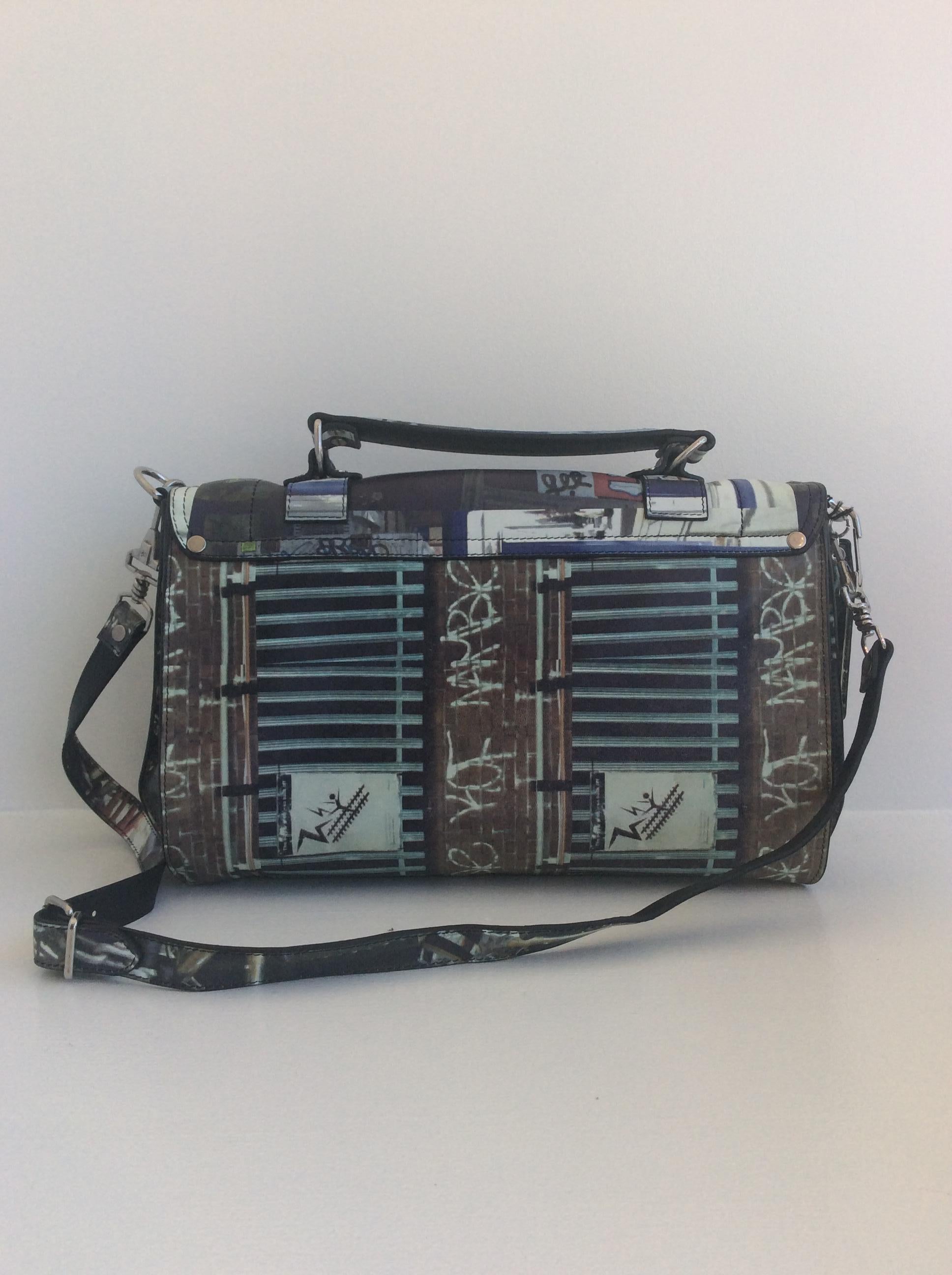 Proenza Schouler spring summer 2013 graffiti print purse with silver buckle and removable shoulder strap with inside zip pocket and separate front compartment. This is brand new with tags.