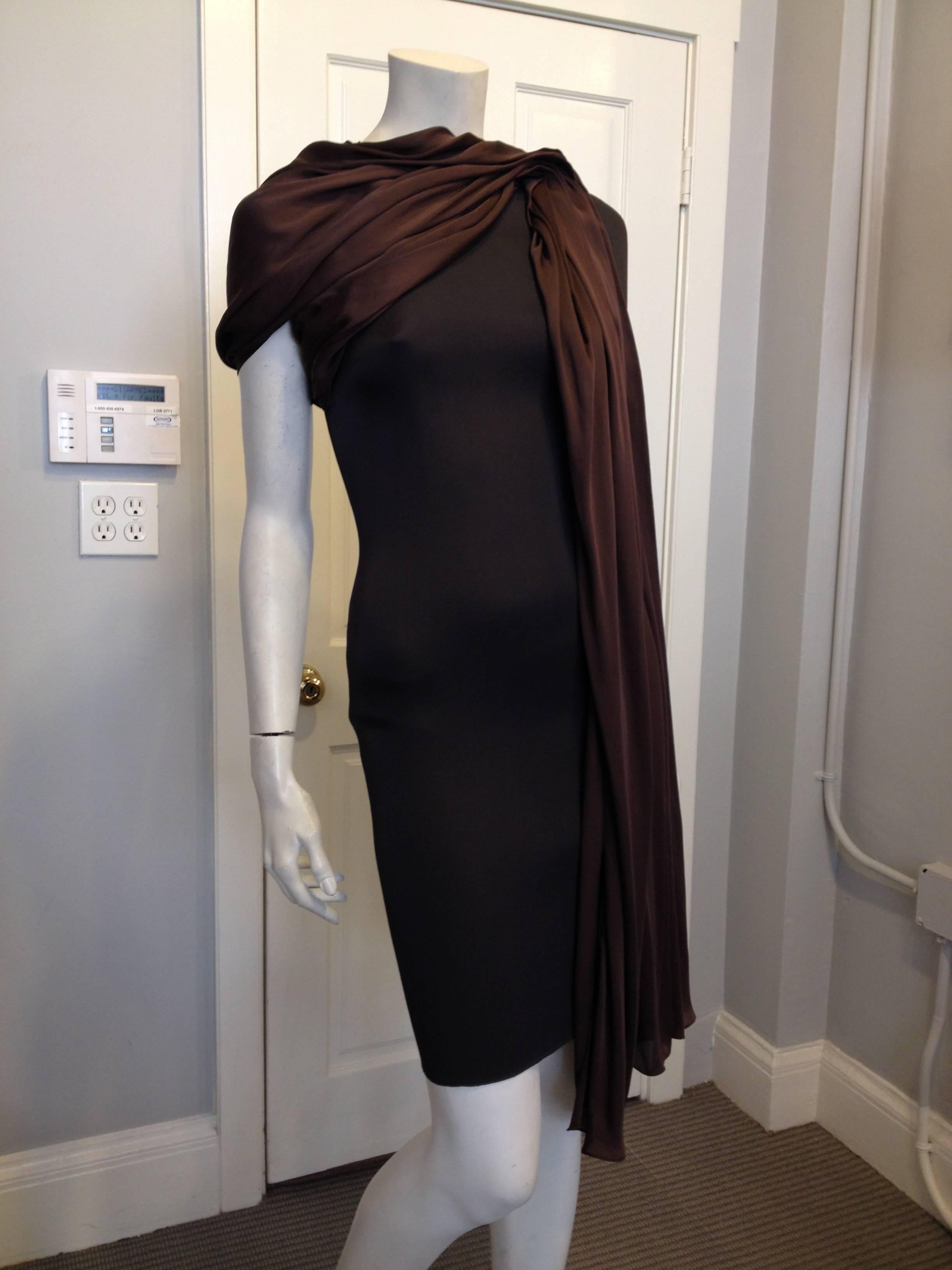 What a gorgeous piece! We love the way Lanvin drapes fabric, an aesthetic that Jeanne Lanvin was originally recognized for early in her career. This piece is cut slim and body conscious, from a stretchy elasticized fabric that zips all the way down