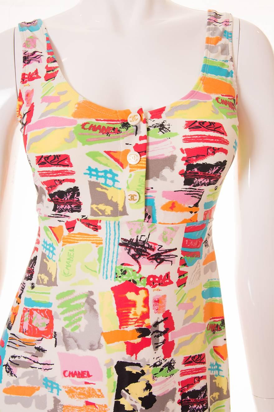 This mini dress by Chanel is from the 1997 Cruise collection and features the most incredible scribble style print.  The print is in vibrant shades of lime green, lemon yellow, turquoise, soft pink and red.  At the top of the dress is a placket with