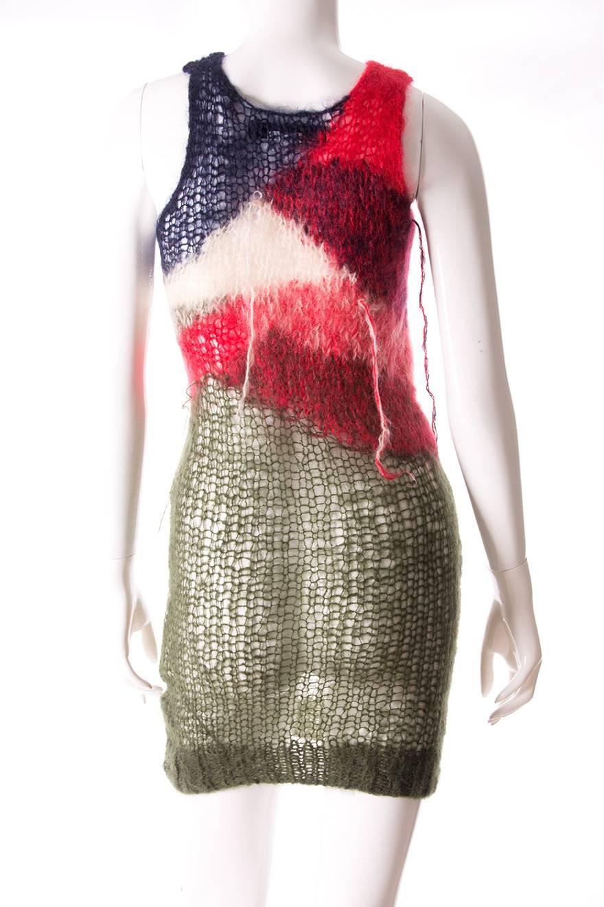 This incredible shredded, hand knitted dress by Comme Des Garcons is from the label's 2006 collection.  This piece was famously inspired by a similar knit worn by Johnny Rotten from the Sex Pistols in the 70s. Designed by Junya Watanabe. 

Marked