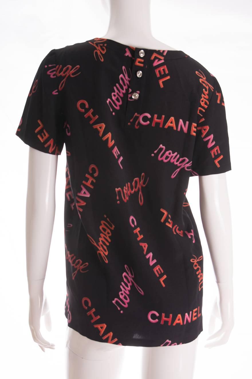 Silk top by Chanel in an iconic allover 'Chanel Rouge' print.  Silver signature Chanel buttons at the back of the top, featuring Coco Chanel's face.

Marked size 38 
To fit S
Chest - 48.5 cm
Waist - 48.5 cm
Length - 67 cm

Excellent vintage